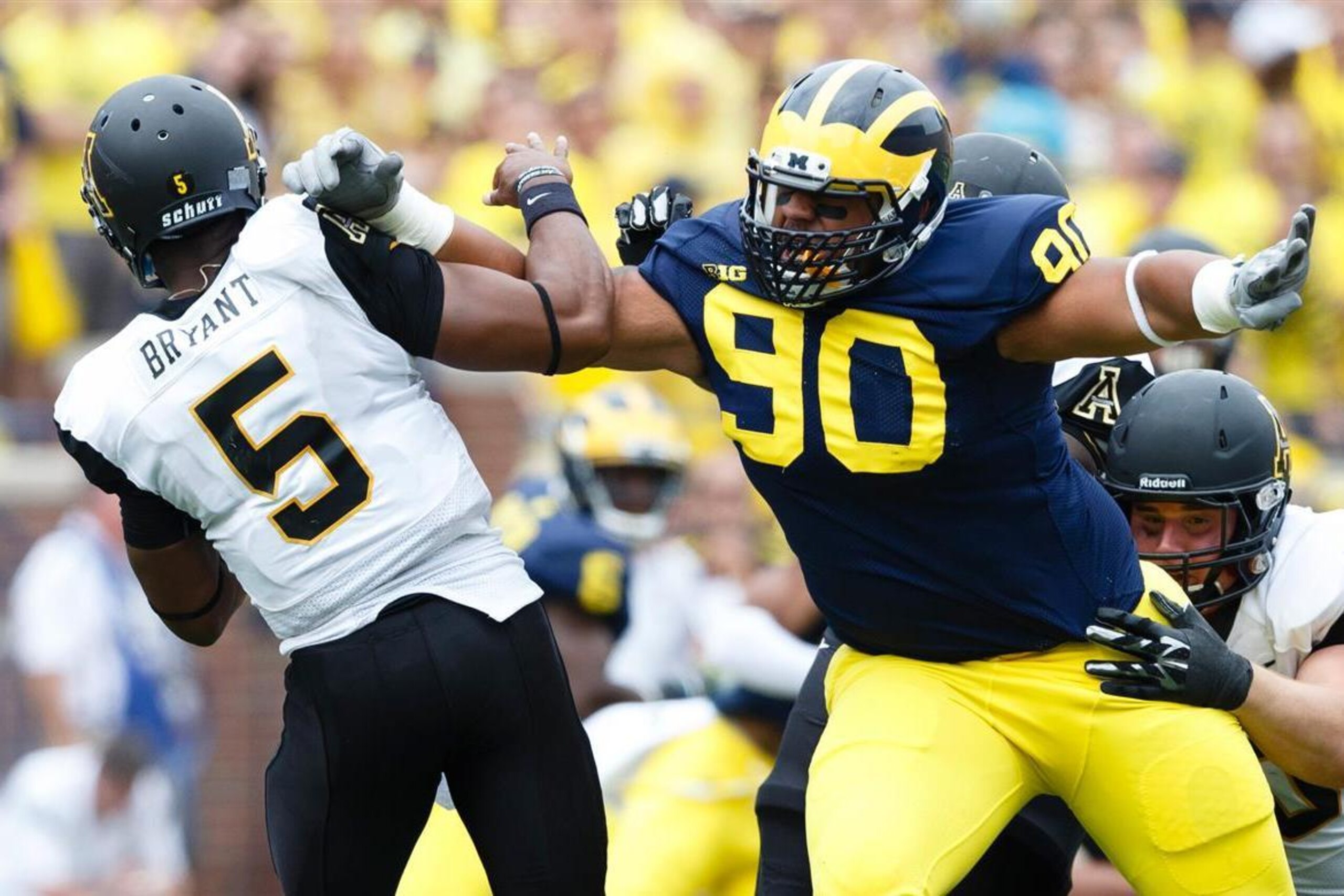 Bryan Mone won't line up in the trenches during the 2015 campaign.