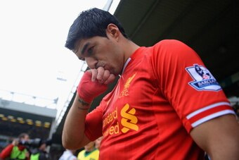 NORWICH, ENGLAND - APRIL 20:  Luis Suarez of Liverpool kisses his hand as he walks out during the Barclays Premier League match between Norwich City and Liverpool at Carrow Road on April 20, 2014 in Norwich, England.  (Photo by Michael Regan/Getty Images)