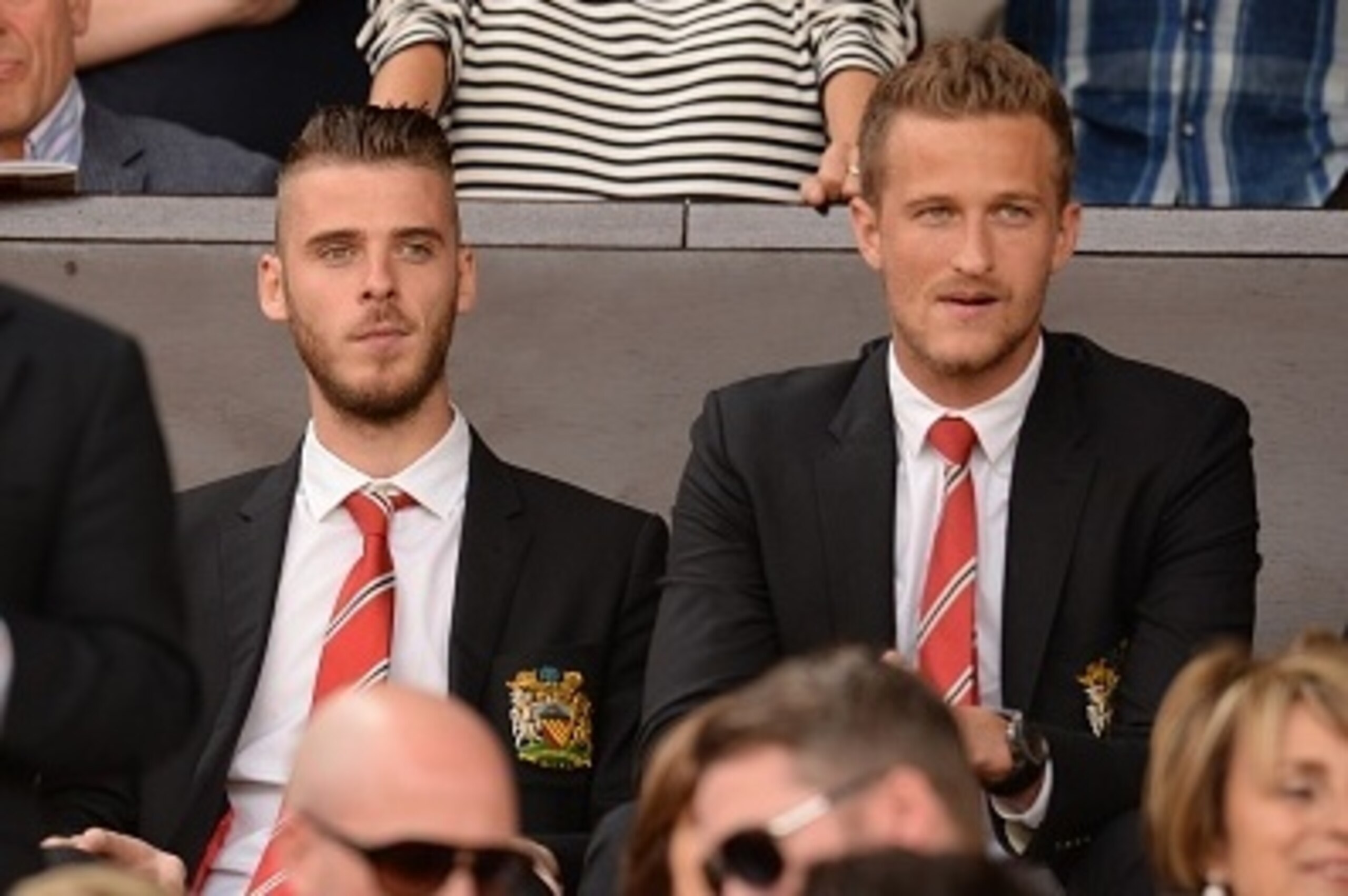 Manchester United's Spanish goalkeeper David de Gea (C) watches from the stands ahead of the English Premier League football match between Manchester United and Tottenham Hotspur at Old Trafford in Manchester, north west England, on August 8, 2015. AFP PH Manchester United's Spanish goalkeeper David de Gea (C) watches from the stands ahead of the English Premier League football match between Manchester United and Tottenham Hotspur at Old Trafford in Manchester, north west England, on August 8, 2015. AFP PH