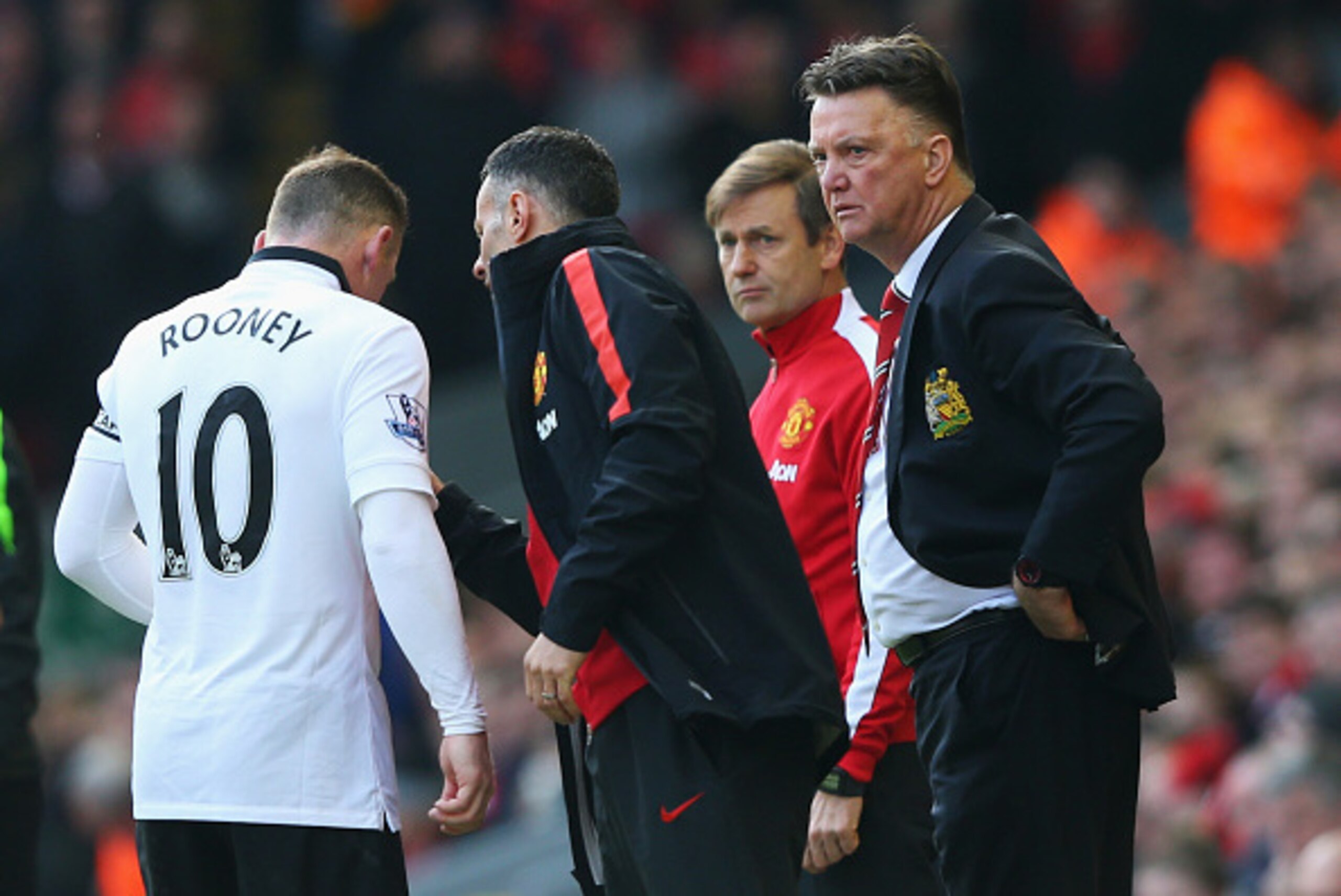LIVERPOOL, ENGLAND - MARCH 22: Louis van Gaal, manager of Manchester United and assistant Ryan Giggs talk to Wayne Rooney during the Barclays Premier League match between Liverpool and Manchester United at Anfield on March 22, 2015 in Liverpool, England. 