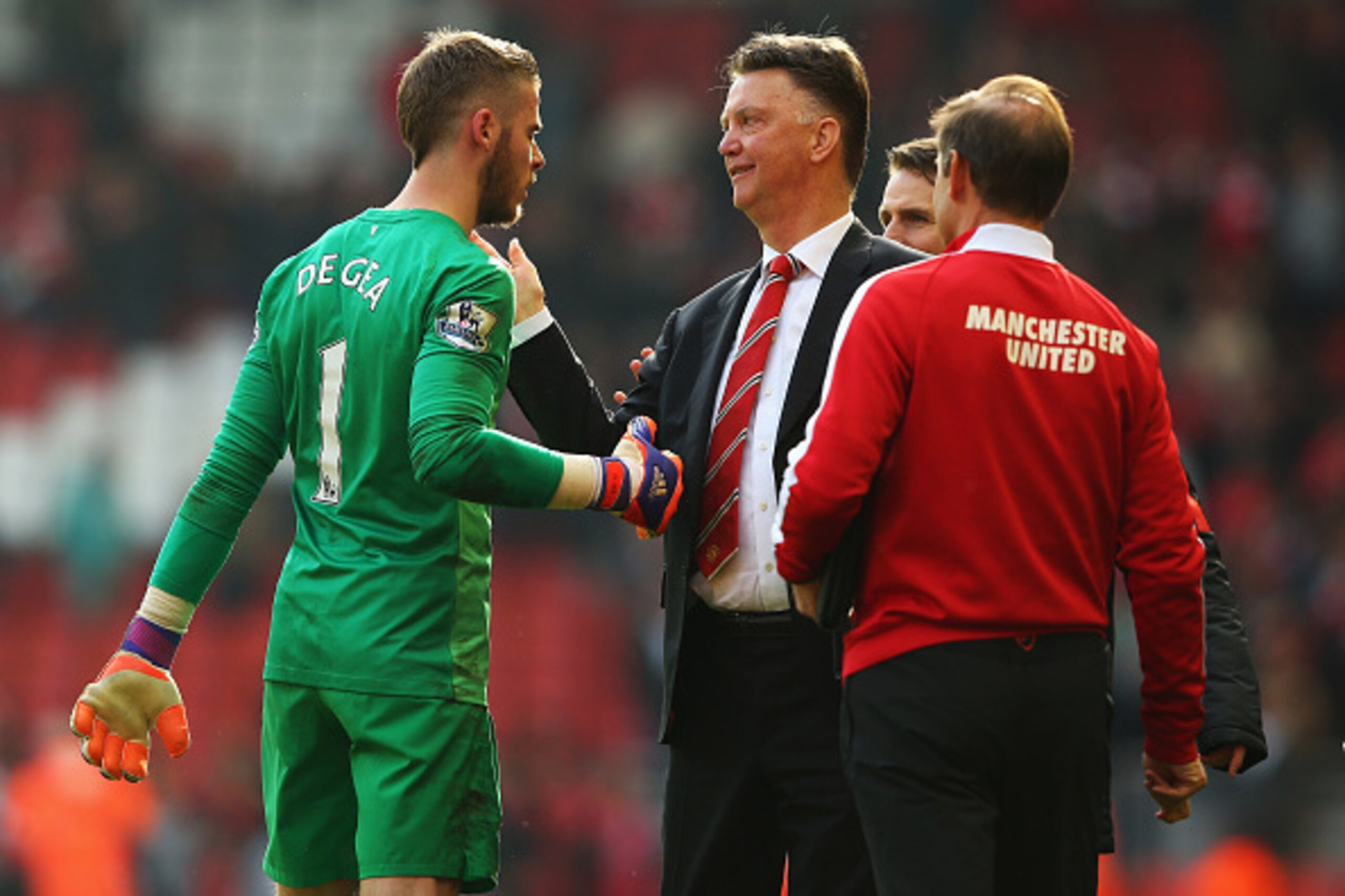 LIVERPOOL, ENGLAND - MARCH 22:  Louis van Gaal, manager of Manchester United celebrates victory with David De Gea of Manchester United after the Barclays Premier League match between Liverpool and Manchester United at Anfield on March 22, 2015 in Liverpoo