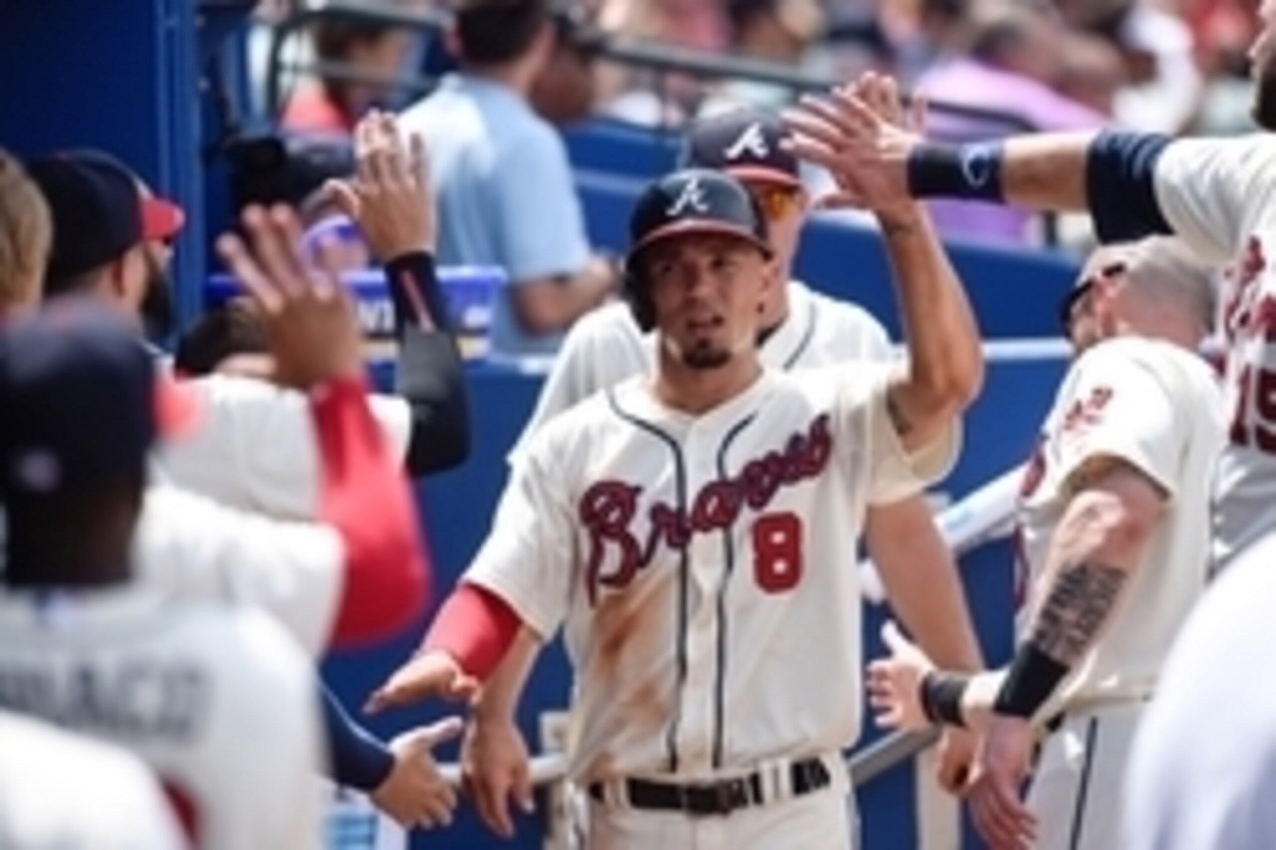 Aug 16, 2015; Atlanta, GA, USA; Atlanta Braves second baseman Jace Peterson (8) gets high fives after scoring the first run of the game against the Arizona Diamondbacks during the fifth inning at Turner Field. Mandatory Credit: Dale Zanine-USA TODAY Sport