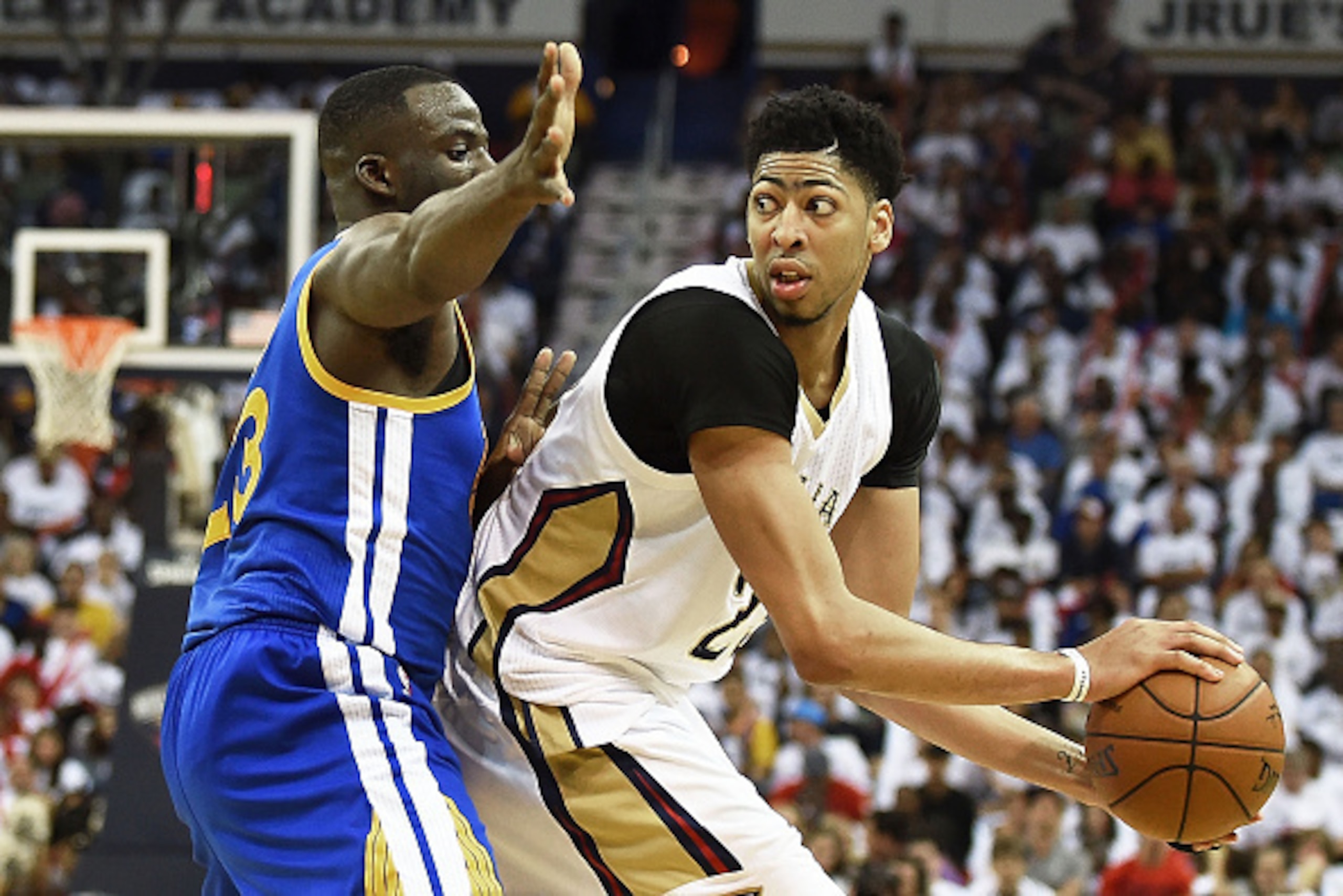 NEW ORLEANS, LA - APRIL 25:  Anthony Davis #23 of the New Orleans Pelicans is defended by Draymond Green #23 of the Golden State Warriors during Game Four in the first round of the 2015 NBA Playoffs at the Smoothie King Center on April 25, 2015 in New Orl