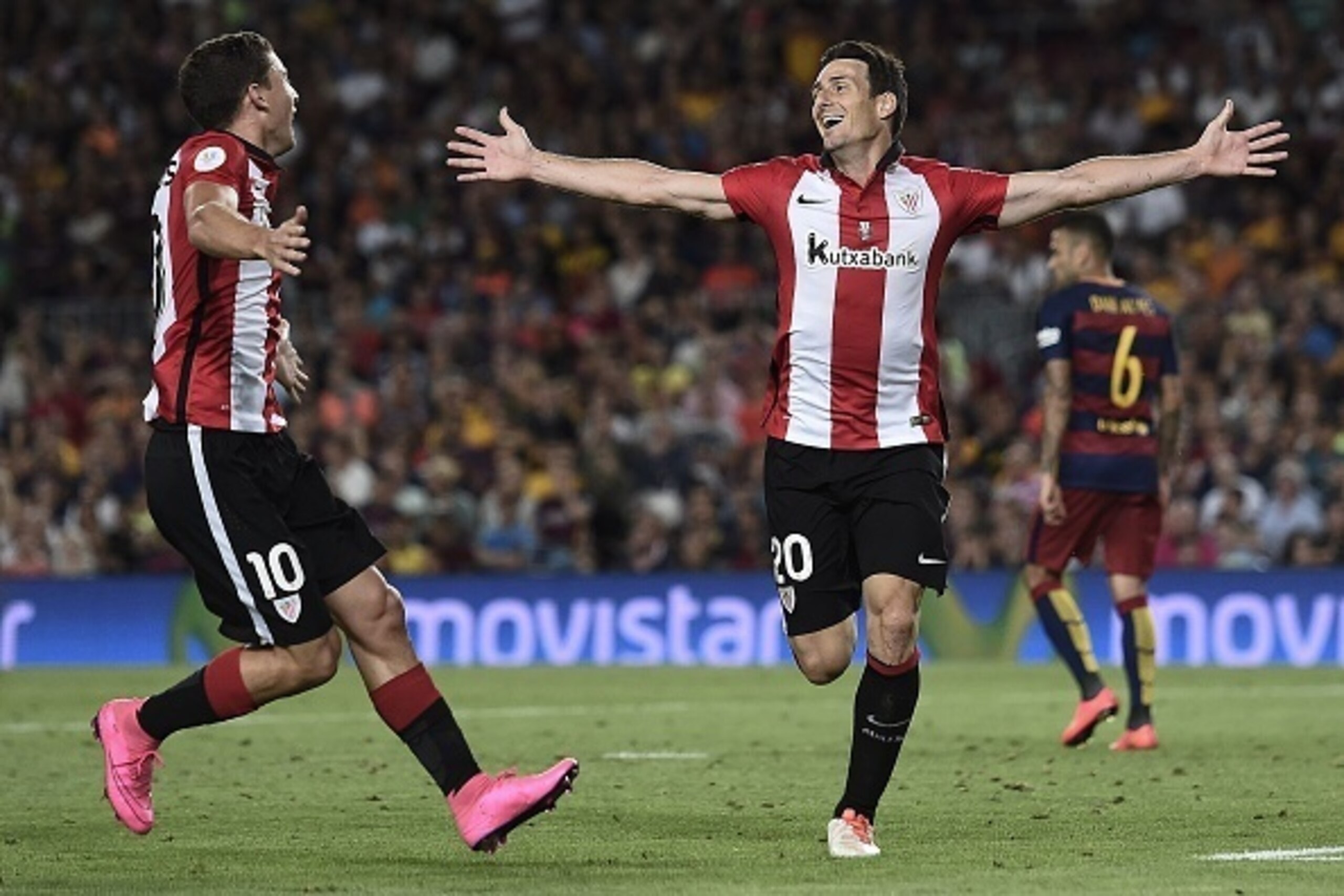 Athletic Bilbao's forward Aritz Aduriz (R) celebrates his goal with teammate Athletic Bilbao's midfielder Oscar De Marcos during the Spanish Supercup second-leg football match FC Barcelona vs Athletic club Bilbao at the Camp Nou stadium in Barcelona on Au