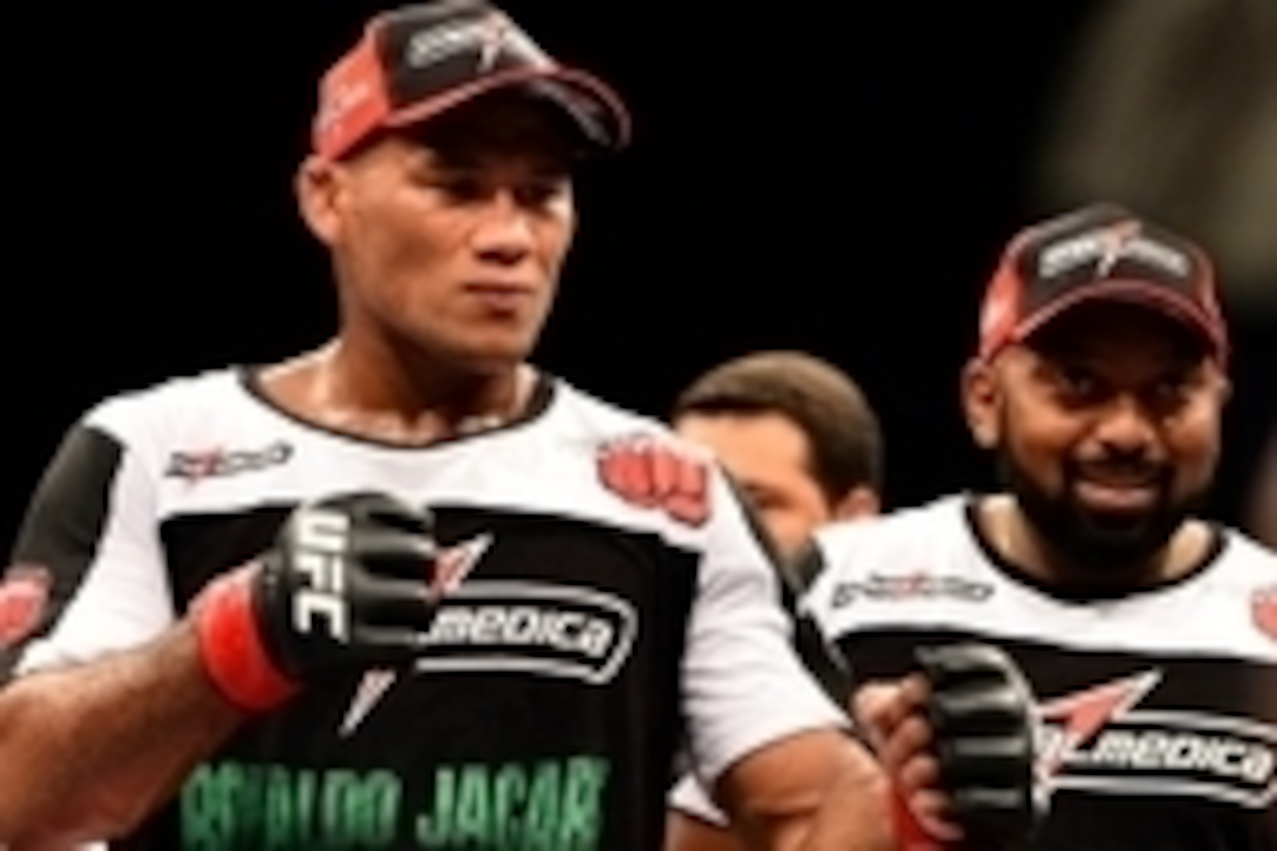 Feb 15, 2014; Jaragua do Sul, SC, Brazil; Ronaldo Souza (red gloves) after defeating Francis Carmont (blue gloves) during UFC Fight Night Machida vs Mousasi at Arena Jaragua. Mandatory Credit: Jason Silva-USA TODAY Sports