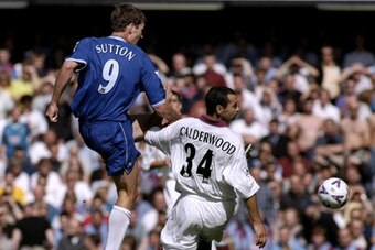 21 Aug 1999:  Chris Sutton of Chelsea tackles Colin Calderwood of Aston Villa during the FA Carling Premiership match played at Stamford Bridge in London, England. Chelsea won the game 1-0. \ Mandatory Credit: Laurence Griffiths /Allsport