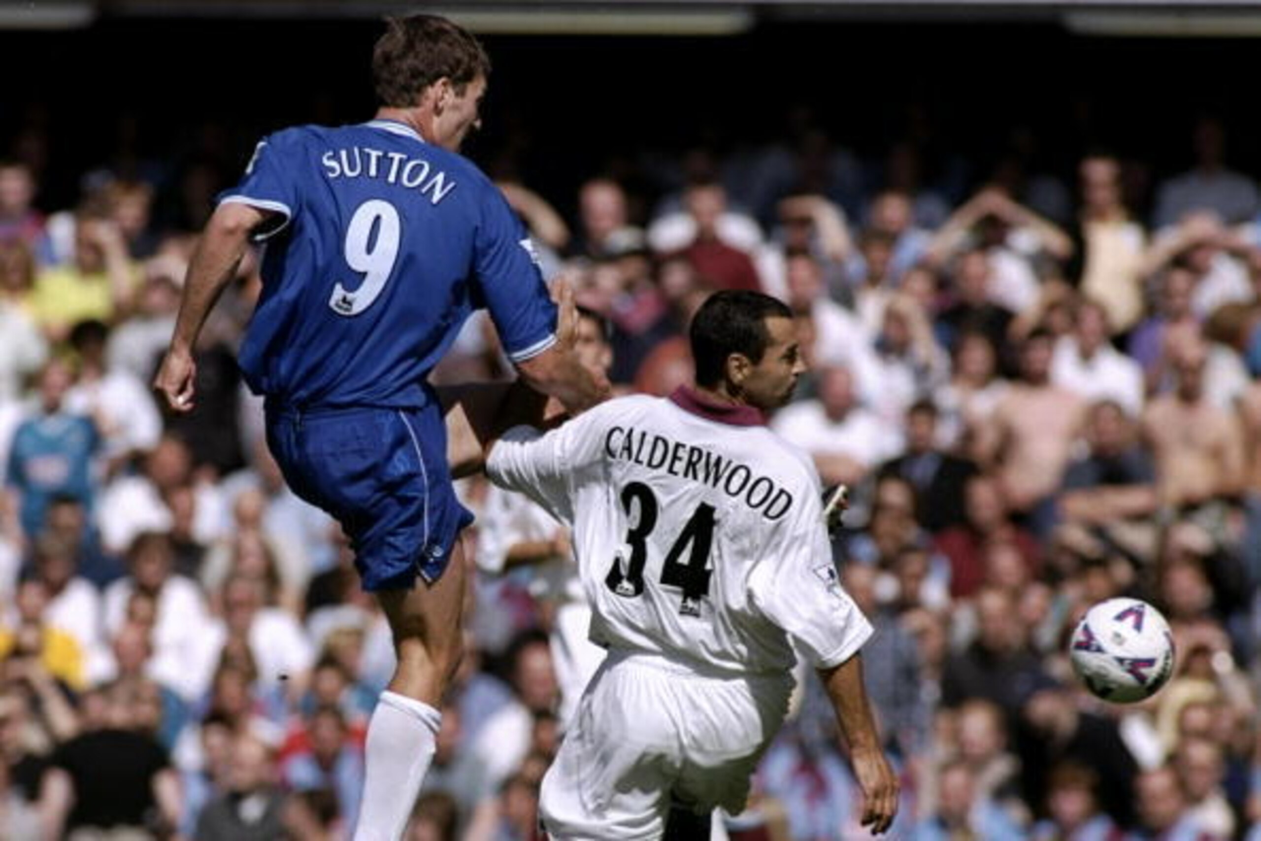 21 Aug 1999:  Chris Sutton of Chelsea tackles Colin Calderwood of Aston Villa during the FA Carling Premiership match played at Stamford Bridge in London, England. Chelsea won the game 1-0. \ Mandatory Credit: Laurence Griffiths /Allsport
