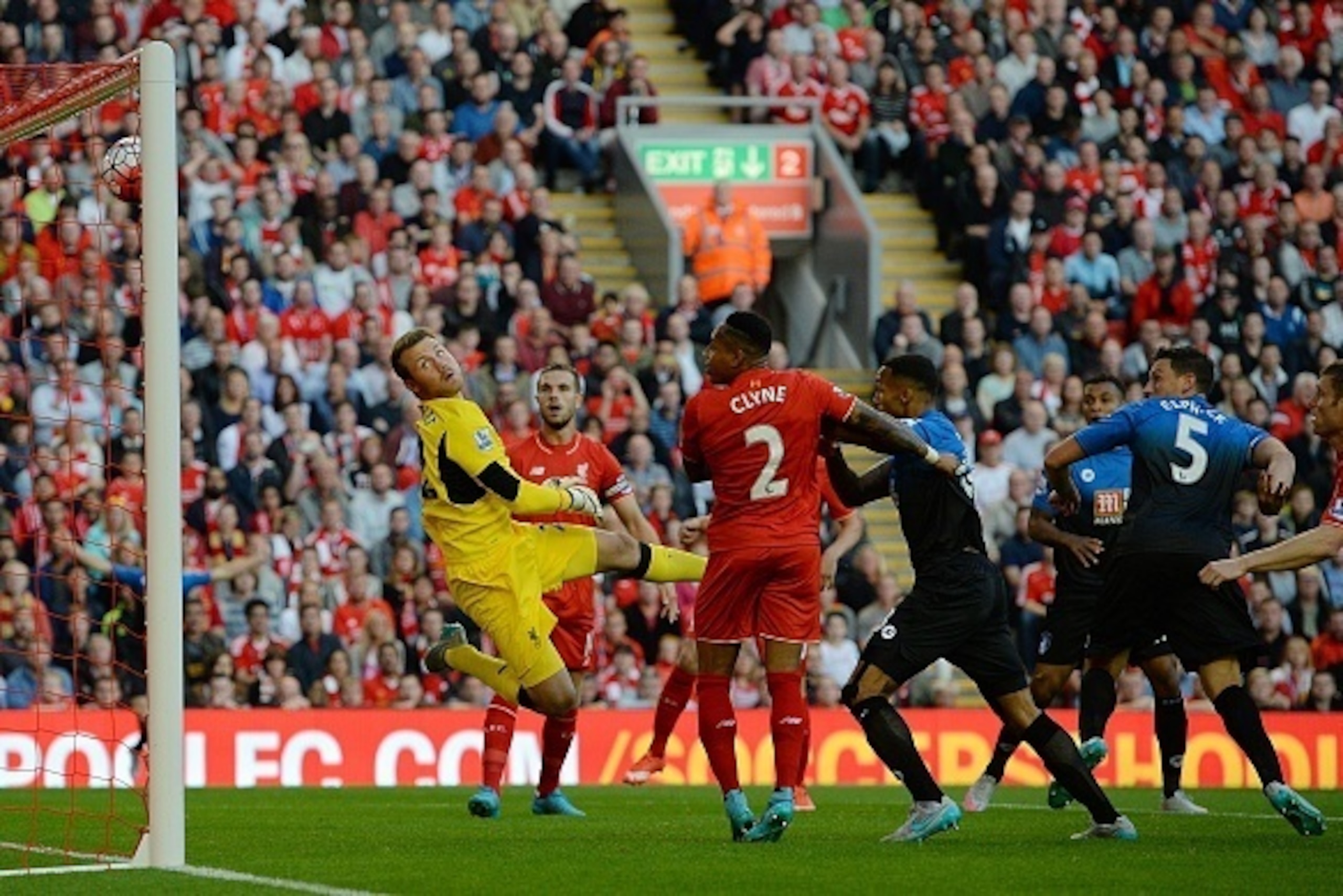 Liverpool's Belgian goalkeeper Simon Mignolet (L) watches as the ball enters his net off a header from Bournemouth's English defender Tommy Elphick (2nd R) during the English Premier League football match between Liverpool and Bournemouth at the Anfield s Liverpool's Belgian goalkeeper Simon Mignolet (L) watches as the ball enters his net off a header from Bournemouth's English defender Tommy Elphick (2nd R) during the English Premier League football match between Liverpool and Bournemouth at the Anfield s