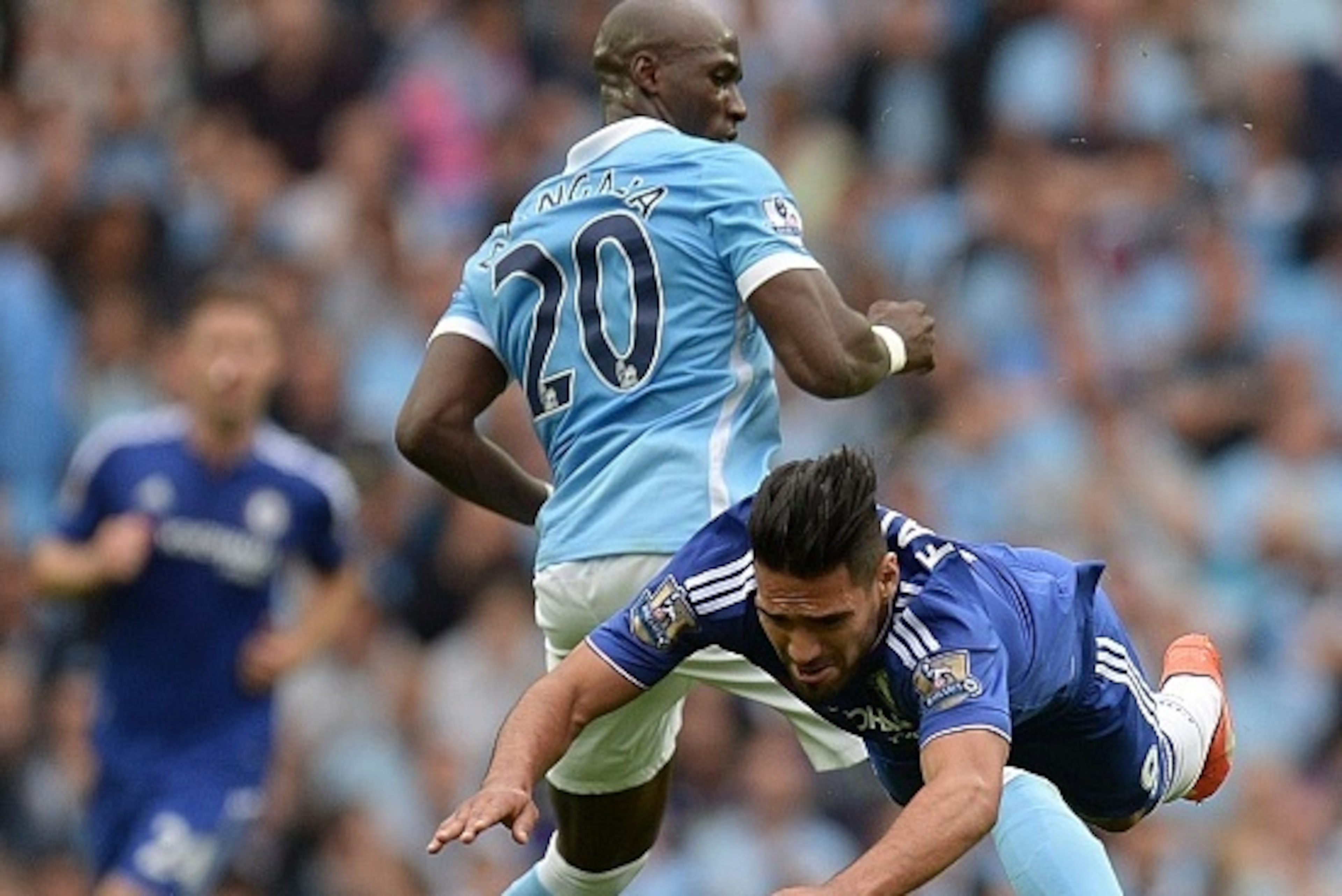 Chelsea's Colombian striker Radamel Falcao (R) is challenged by Manchester City's French defender Eliaquim Mangala during the English Premier League football match between Manchester City and Chelsea at The Etihad stadium in Manchester, north-west England