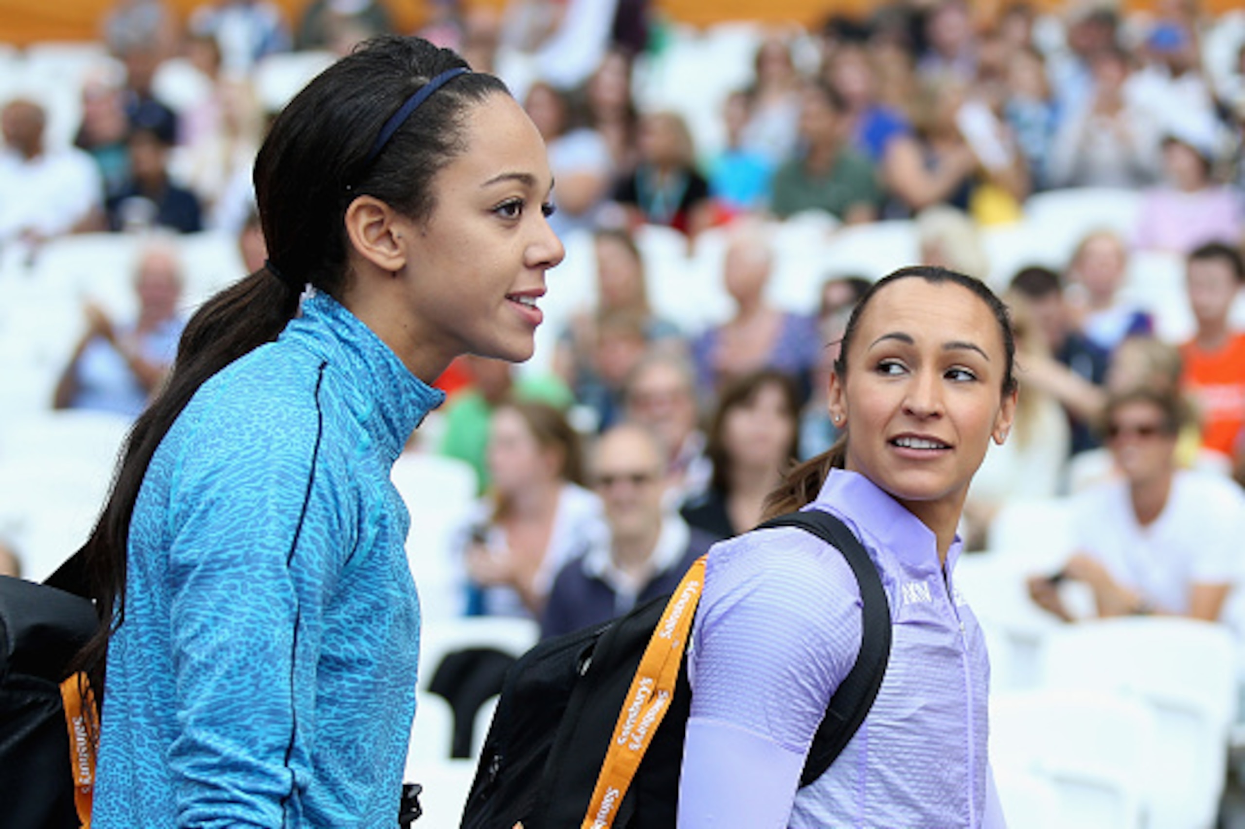 LONDON, ENGLAND - JULY 25:  Katarina Johnson-Thompson (L) and Jessica Ennis-Hill of Great Britain walk out into the stadium prior to competing in the Womens Long Jump during day two of the Sainsbury's Anniversary Games at The Stadium - Queen Elizabeth Oly