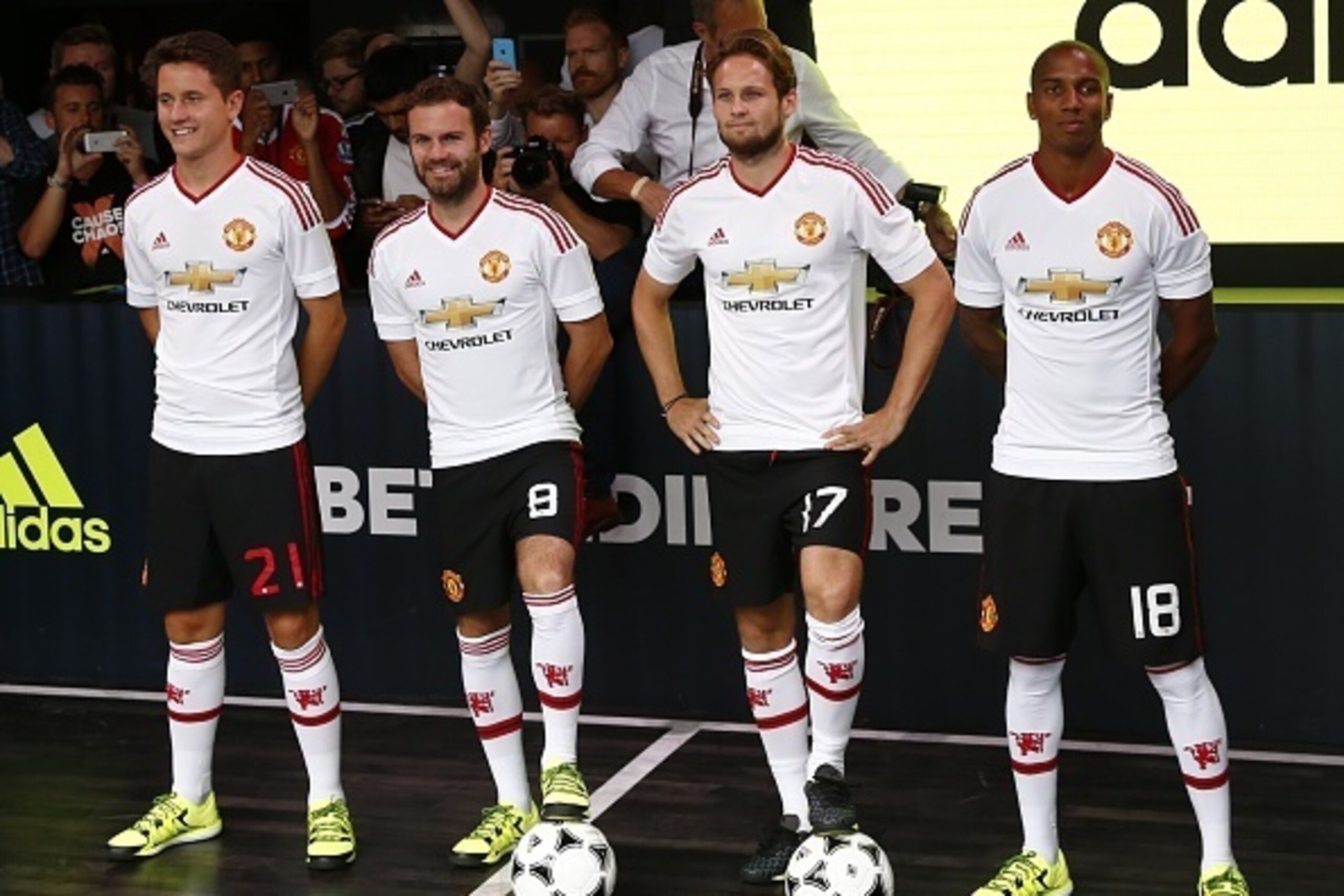 (L-R) Manchester United's Spanish midfielder Ander Herrera, Manchester United's Spanish midfielder Juan Mata, Manchester United's Dutch midfielder Daley Blind and Manchester United's English midfielder Ashley Young pose in the new Adidas away kit at a lau