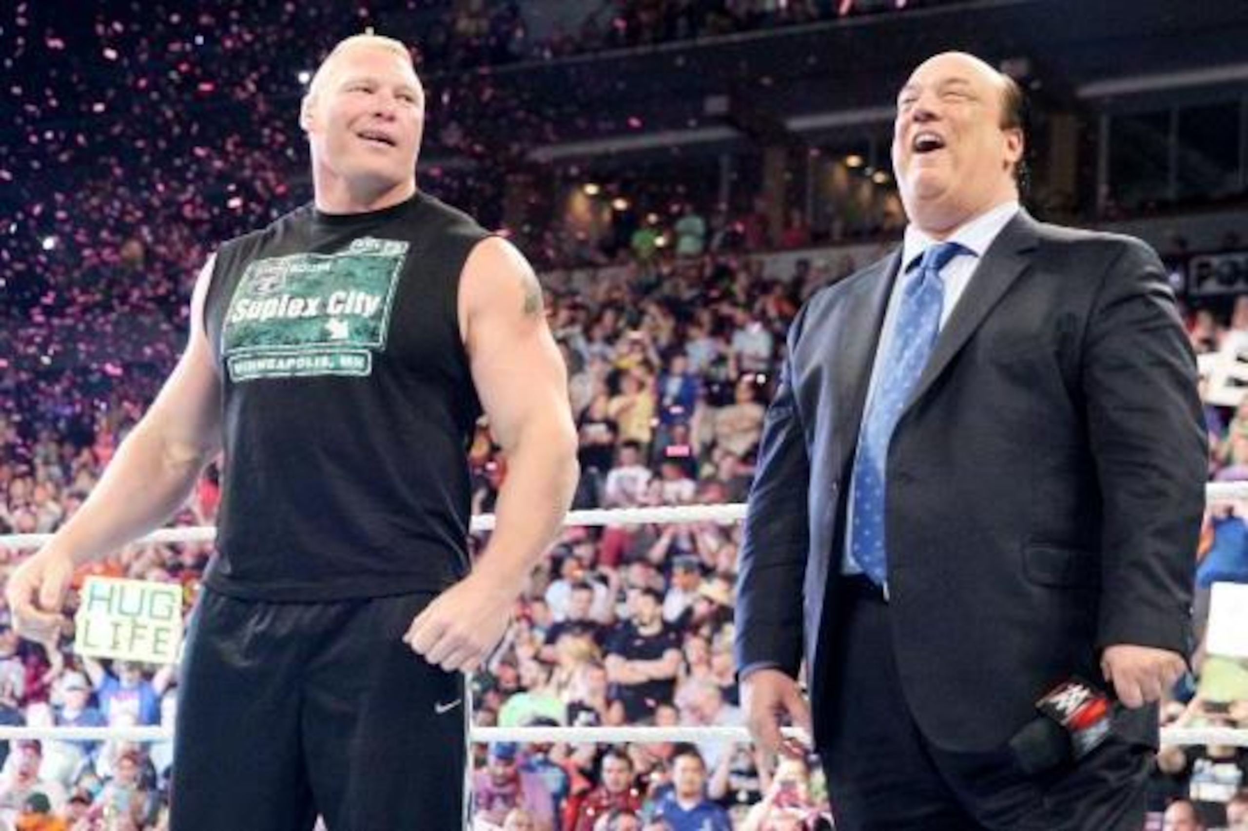 Brock Lesnar and Paul Heyman soak up the response from the Minneapolis crowd.
