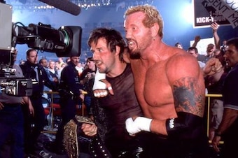 Diamond Dallas Page celebrates David Arquette's title win.