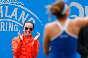 EASTBOURNE, ENGLAND - JUNE 23:  Belinda Bencic of Switzerland celebrates defeating Madison Keys of USA as Martina Hingis show her support during the Aegon International day three at Devonshire Park on June 23, 2015 in Eastbourne, England.  (Photo by Julia
