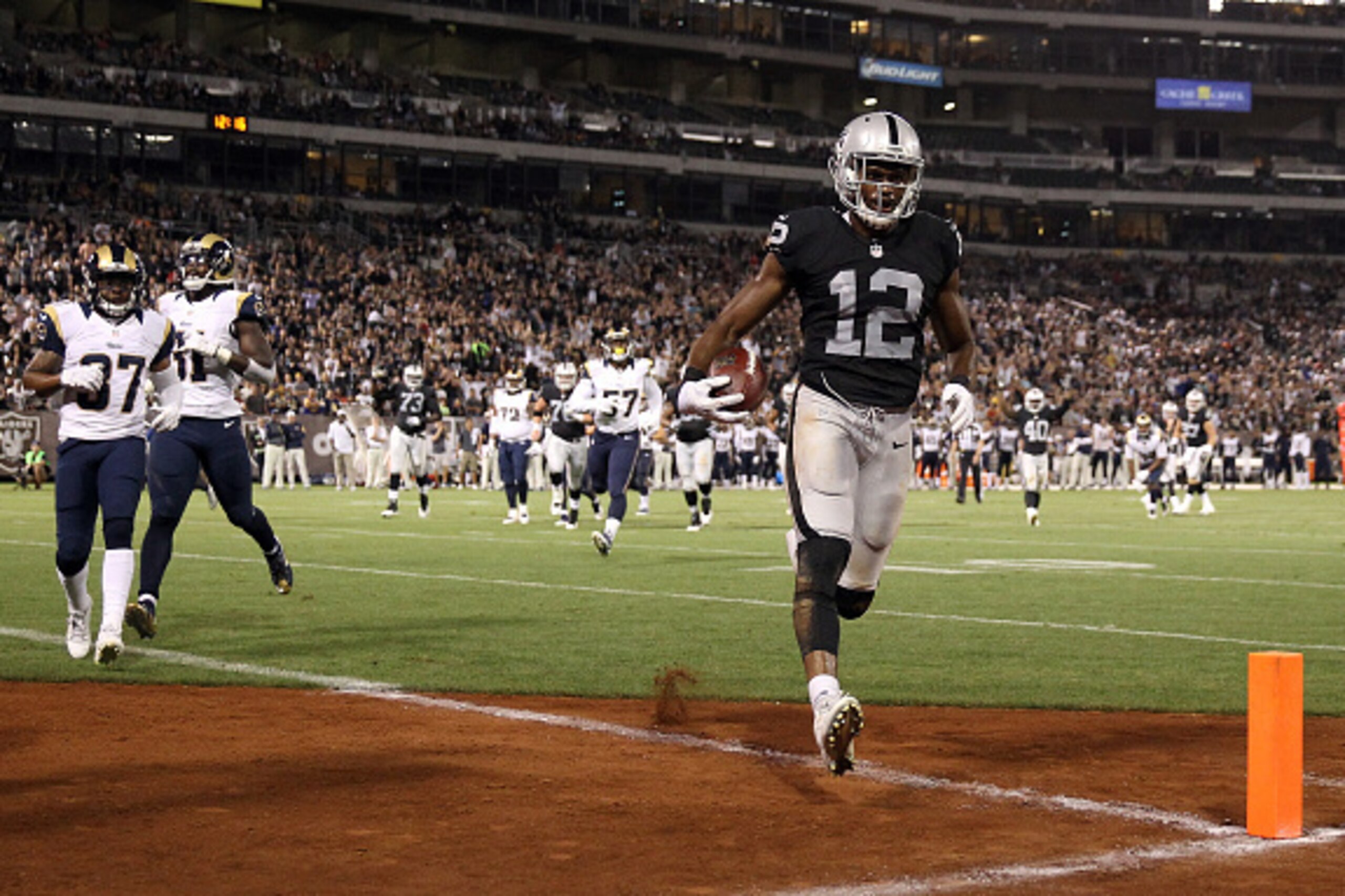 OAKLAND, CA - AUGUST 14:  Brice Butler #12 of the Oakland Raiders runs in for a touchdown against the St. Louis Rams at O.co Coliseum on August 14, 2015 in Oakland, California.  (Photo by Ezra Shaw/Getty Images)