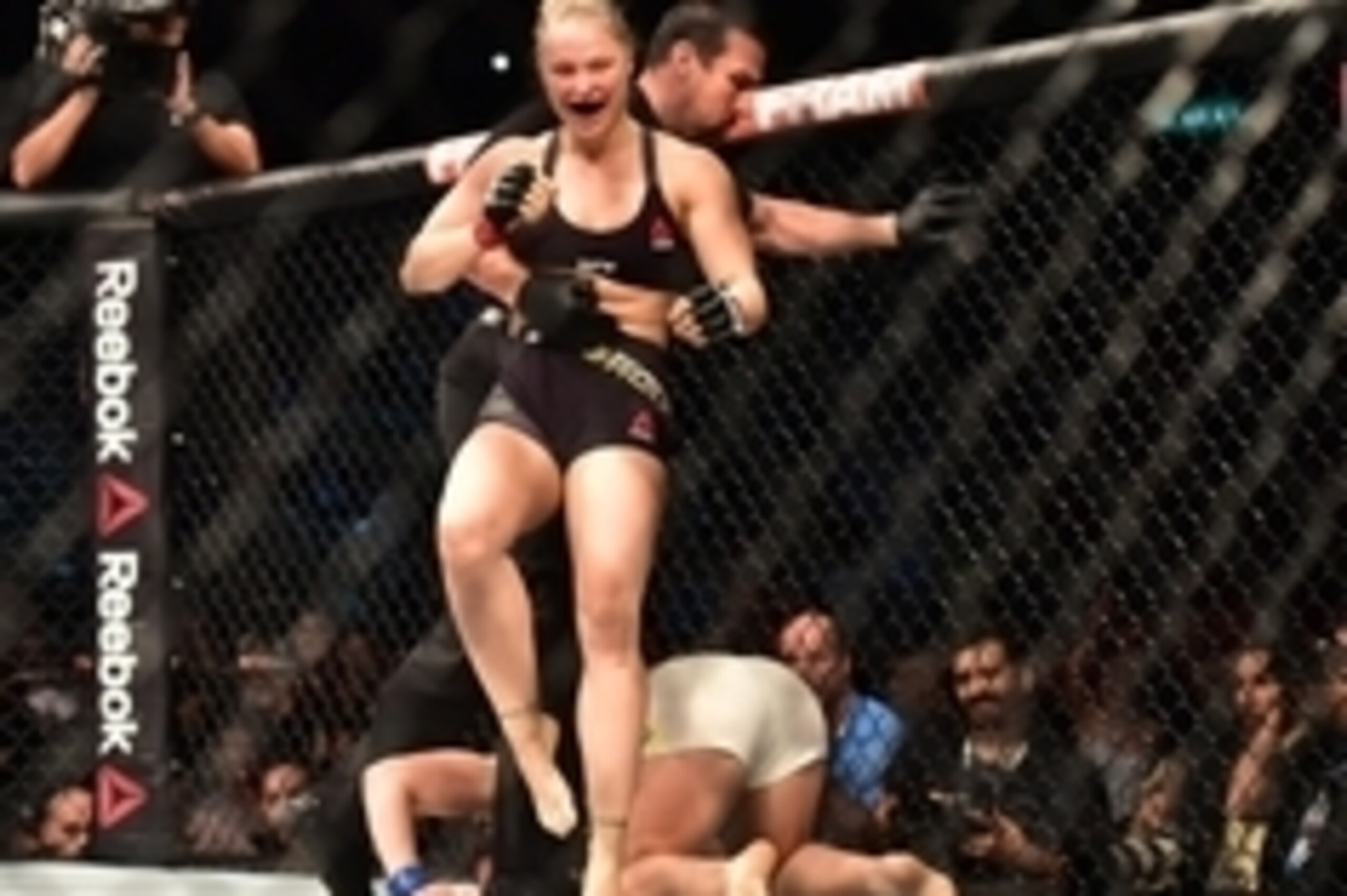 Aug 1, 2015; Rio de Janeiro, RJ, Brazil; Ronda Rousey (red gloves) fights Bethe Correia (blue gloves) during UFC 190 at HSBC Arena. Mandatory Credit: Jason Silva-USA TODAY Sports