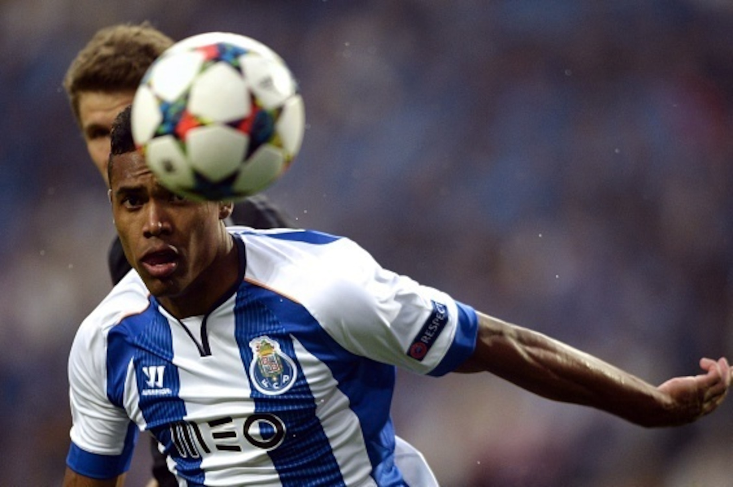 Porto's Brazilian defender Alex Sandro looks at the ball during the UEFA Champions League quarter final football match FC Porto vs FC Bayern Munich at the at the Dragao stadium in Porto on April 15, 2015.   AFP PHOTO / MIGUEL RIOPA        (Photo credit sh