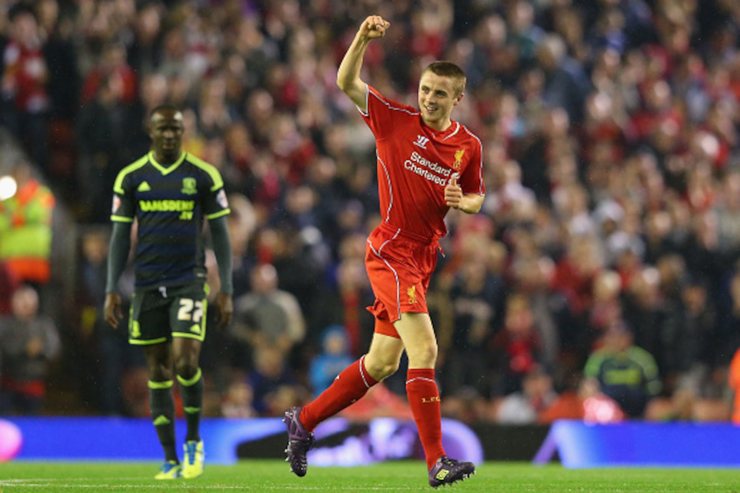 LIVERPOOL, ENGLAND - SEPTEMBER 23:  Jordan Rossiter of Liverpool celebrates after scoring the opening goal during the Capital One Cup Third Round match between Liverpool and Middlesbrough at Anfield on September 23, 2014 in Liverpool, England.  (Photo by 