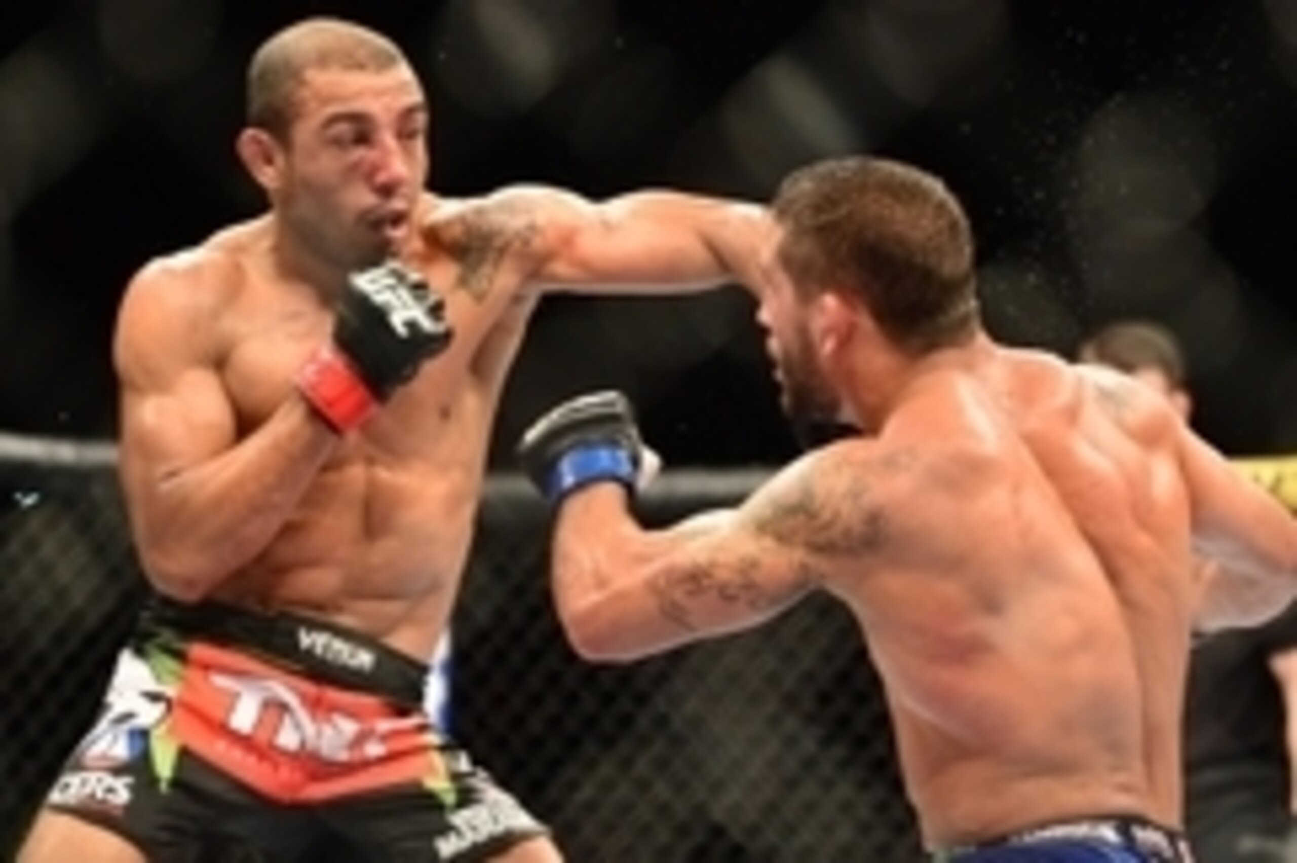 Oct 25, 2014; Rio de Janeiro, Brazil; Jose Aldo (red gloves) fights against Chad Mendez (blue gloves) during UFC 179 at Ginasio do Maracanazinho. Mandatory Credit: Jason Silva-USA TODAY Sports
