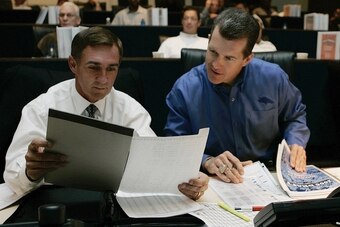 Coach Mike Shanahan and Ted Sundquist confer during the 2006 draft.