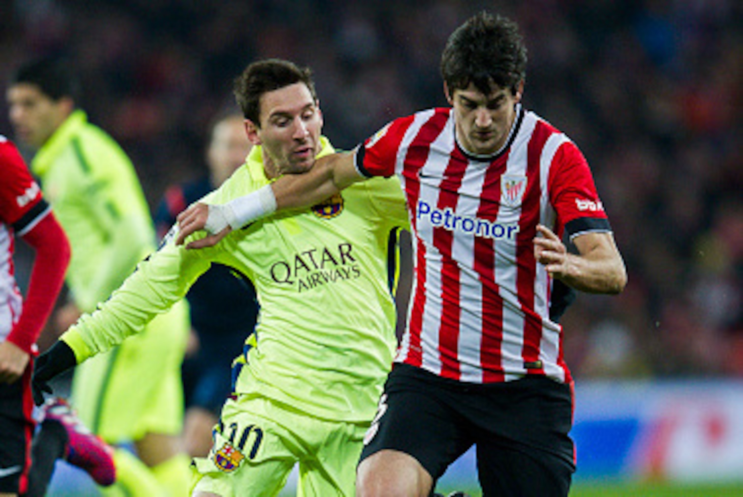 BILBAO, SPAIN - FEBRUARY 08: Lionel Messi of FC Barcelona duels for the ball with Mikel San Jose of Athletic Club during the La Liga match between Athletic Club and FC Barcelona at San Mames Stadium on February 8, 2015 in Bilbao, Spain. (Photo by Juan M BILBAO, SPAIN - FEBRUARY 08: Lionel Messi of FC Barcelona duels for the ball with Mikel San Jose of Athletic Club during the La Liga match between Athletic Club and FC Barcelona at San Mames Stadium on February 8, 2015 in Bilbao, Spain. (Photo by Juan M