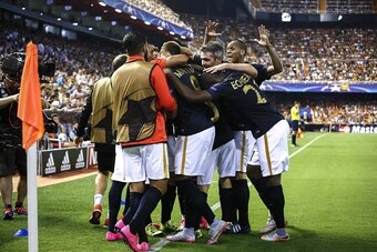 Monaco players celebrate after scoring during the UEFA Champions League playoff football match between Valencia CF vs AS Monaco FC at the Mestalla stadium in Valencia on August 19, 2014.  AFP PHOTO/ BIEL ALINO        (Photo credit should read BIEL ALINO/A