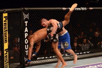LAS VEGAS, NV - MAY 25:   (R-L) Khabib Nurmagomedov slams Abel Trujillo in their lightweight bout during UFC 160 at the MGM Grand Garden Arena on May 25, 2013 in Las Vegas, Nevada.  (Photo by Donald Miralle/Zuffa LLC/Zuffa LLC via Getty Images)