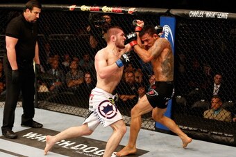 ORLANDO, FL - APRIL 19:  (L-R) Khabib Nurmagomedov punches Rafael dos Anjos in their lightweight bout during the FOX UFC Saturday event at the Amway Center on April 19, 2014 in Orlando, Florida. (Photo by Josh Hedges/Zuffa LLC/Zuffa LLC via Getty Images)