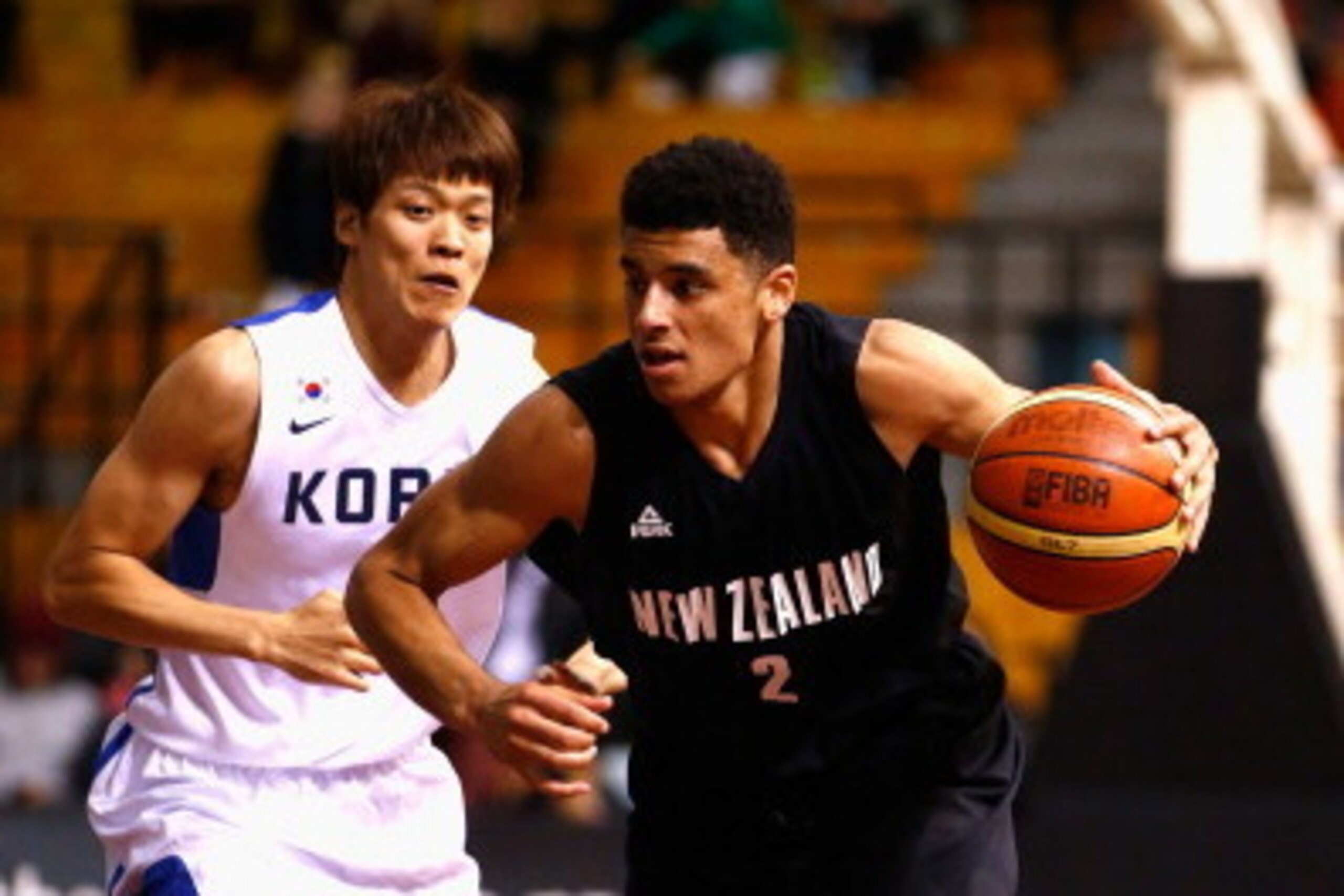 AUCKLAND, NEW ZEALAND - JULY 19: Tai Wynyard of New Zealand runs the ball forward during the international match between the New Zealand Tall Blacks and South Korea at North Shore Events Centre on July 19, 2014 in Auckland, New Zealand.  (Photo by Phil Wa