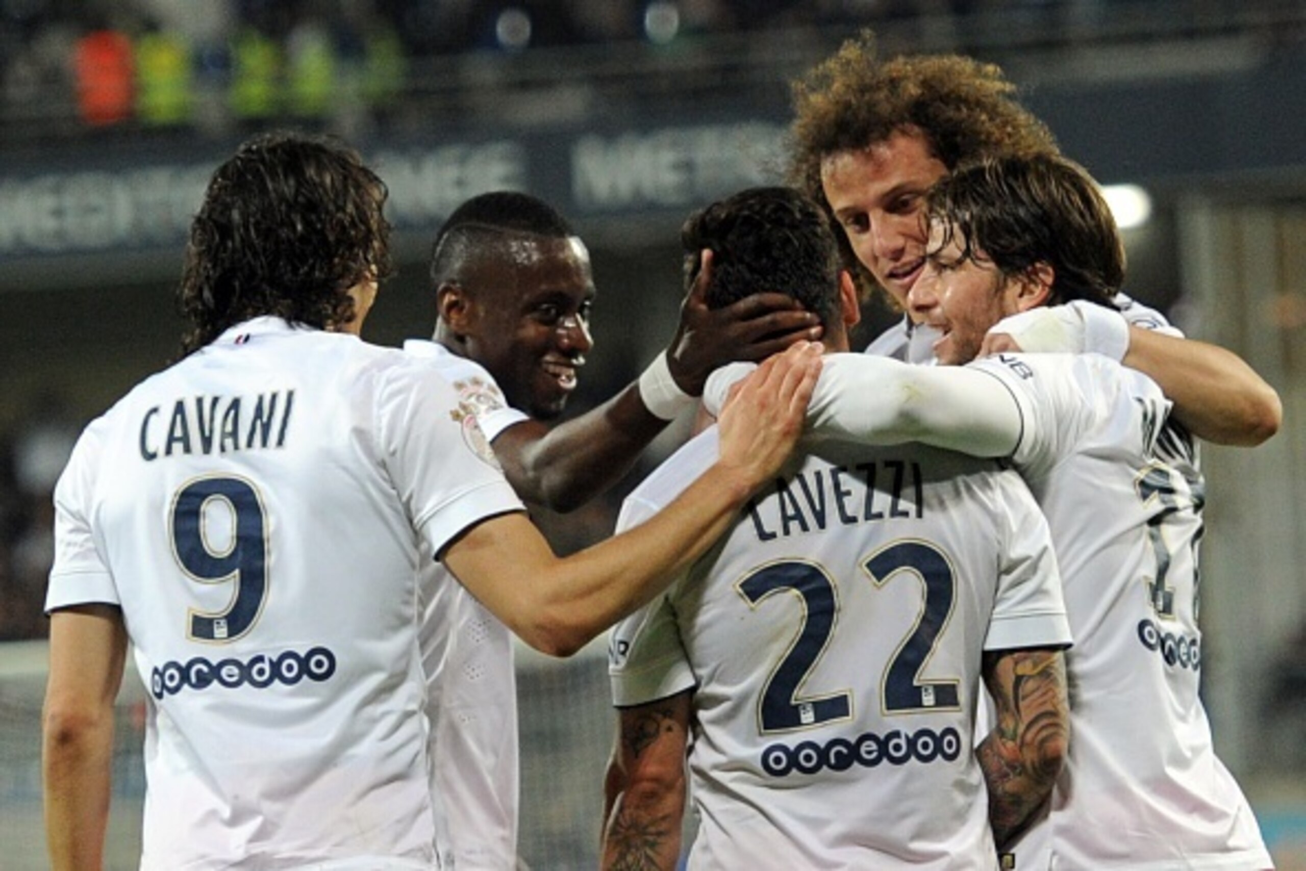 Paris Saint-Germain's Argentinian midfielder Ezequiel Lavezzi (3rd R) is congratulated by teammates after scoring a goal during the French L1 football match between Montpellier (MHSC) and Paris Saint-Germain (PSG) on May 16, 2015 at La Mosson Stadium in M