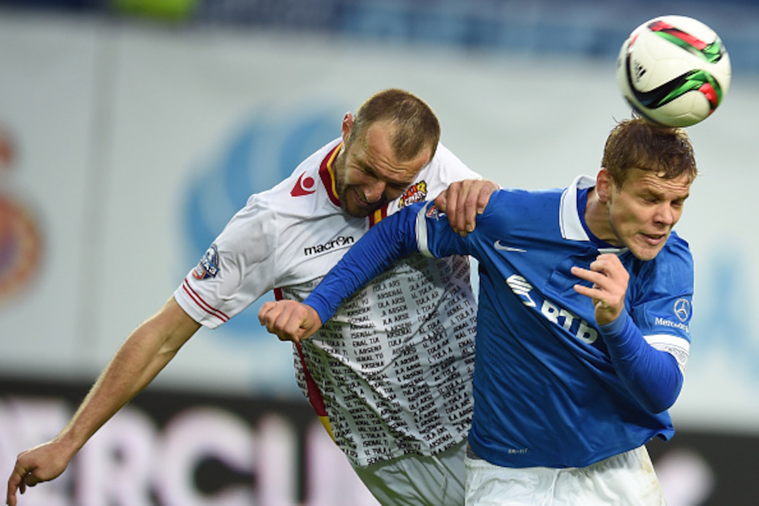 KHIMKI, RUSSIA - MAY 24: Aleksandr Kokorin (R) of FC Dinamo Moscow is challenged by Yevgeni Osipov of FC Arsenal Tula during the Russian Premier League match between FC Dinamo Moscow and FC Arsenal Tula at the Arena Khimki Stadium on May 24, 2015 in Khimk