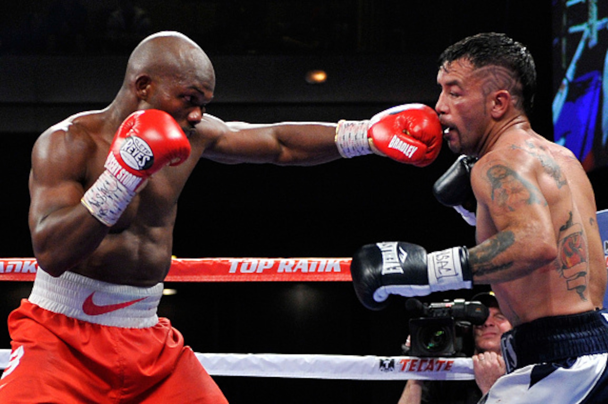 LAS VEGAS, NV - DECEMBER 13:  Timothy Bradley Jr. (L) punches Diego Chaves during their welterweight bout at The Chelsea at The Cosmopolitan of Las Vegas on December 13, 2014 in Las Vegas, Nevada. The 12-round fight ended in a draw.  (Photo by David Becke