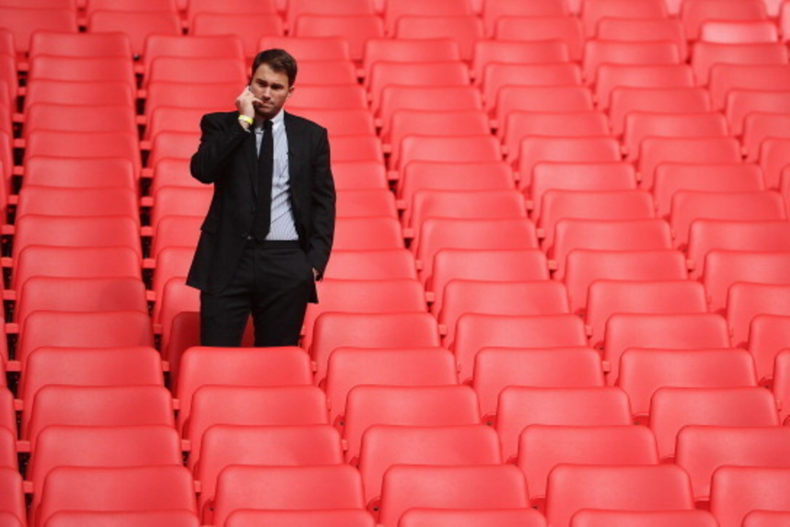 LONDON, ENGLAND - MARCH 04:  Boxing promoter Eddie Hearn talks on the phone during the announcement that Wembley Stadium will stage the rematch between Carl Froch and George Groves on May 31 at Wembley Stadium on March 4, 2014 in London, England.  (Photo 