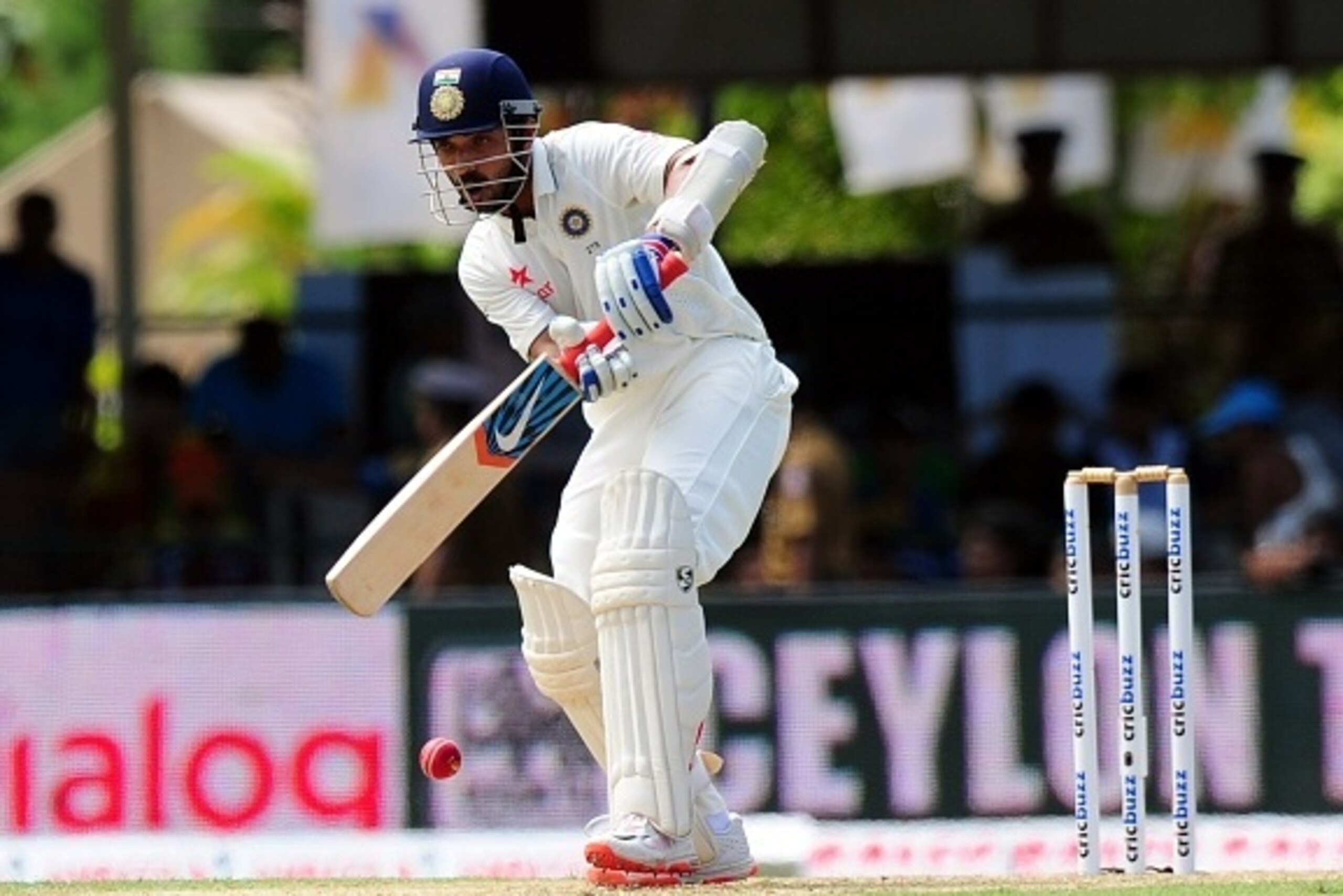 Indian cricketer Ajinkya Rahane plays a shot during the opening day of their second Test match between Sri Lanka and India at the P. Sara Oval Cricket Stadium in Colombo on August 20, 2015.  AFP PHOTO / LAKRUWAN WANNIARACHCHI        (Photo credit should r