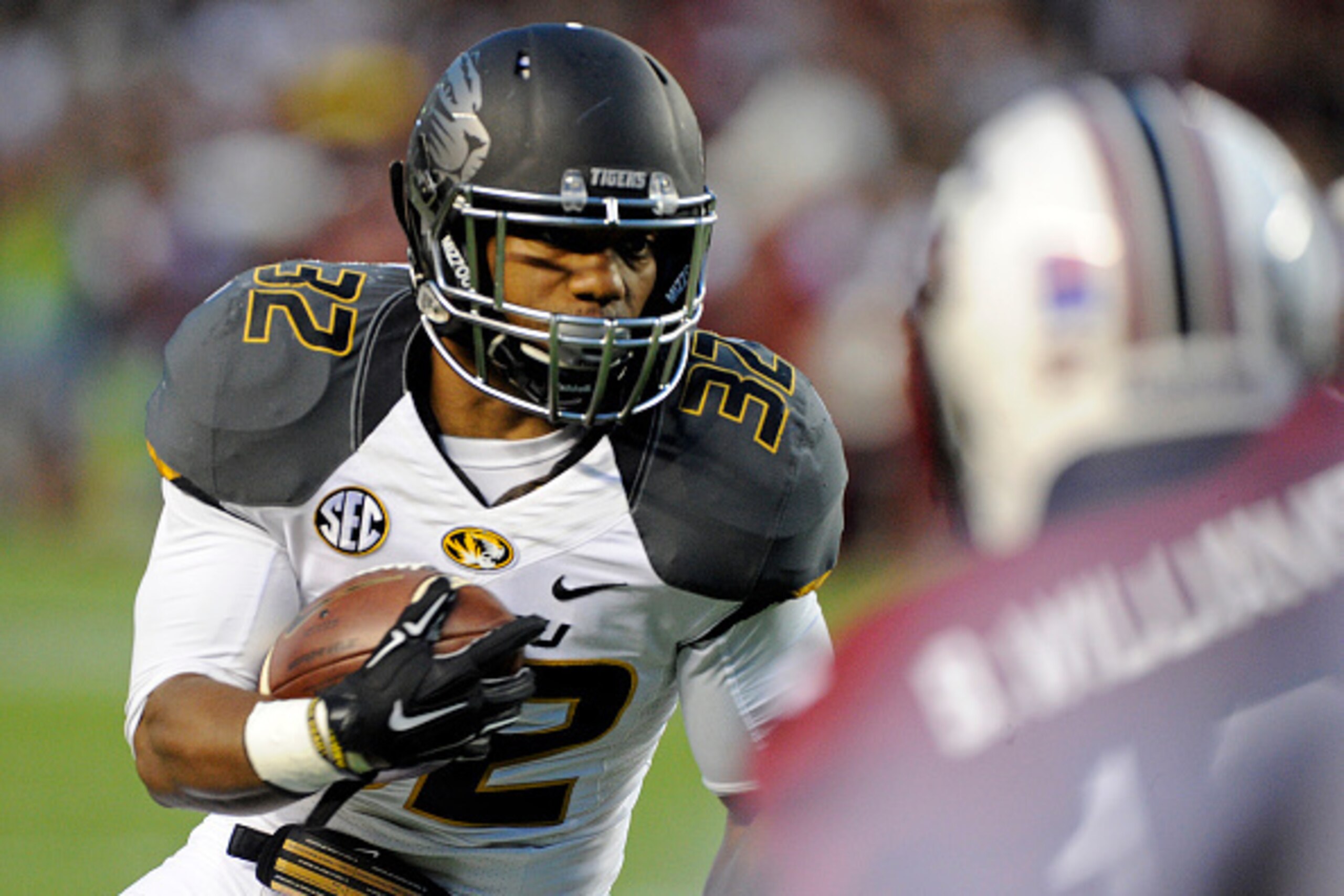 COLUMBIA, SC - SEPTEMBER 27:   Tailback Russell Hansbrough of the Missouri Tigers evades defenders from the South Carolina Gamecocks as he scores a touchdown during the first quarter on September 27, 2014 at Williams-Brice Stadium in Columbia, South Carol