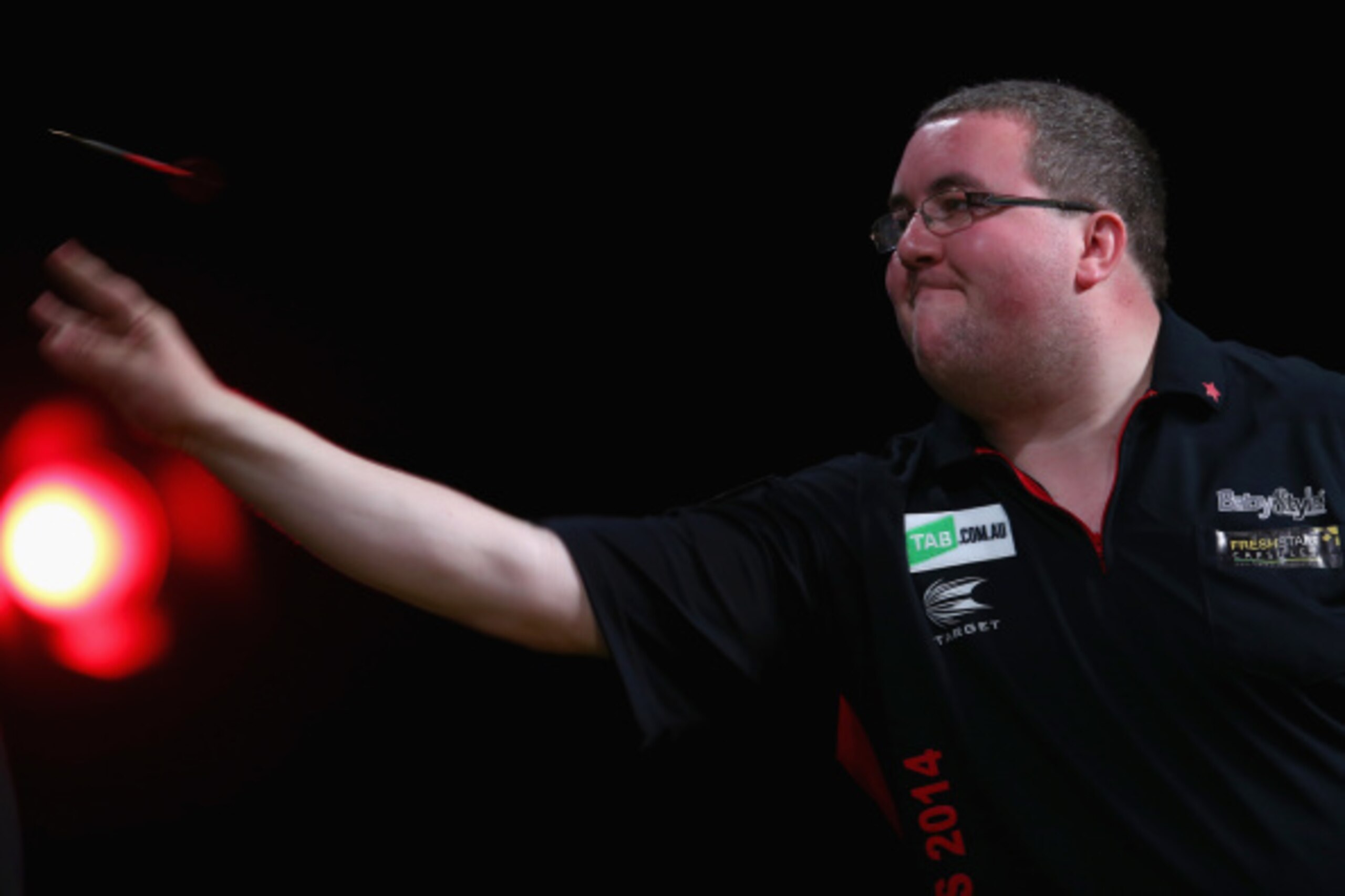SYDNEY, AUSTRALIA - AUGUST 29:  Stephen Bunting of England competes in his quarter-final match against Peter Wright of Scotland during the Sydney Darts Masters at Hordern Pavilion on August 29, 2014 in Sydney, Australia.  (Photo by Mark Kolbe/Getty Images