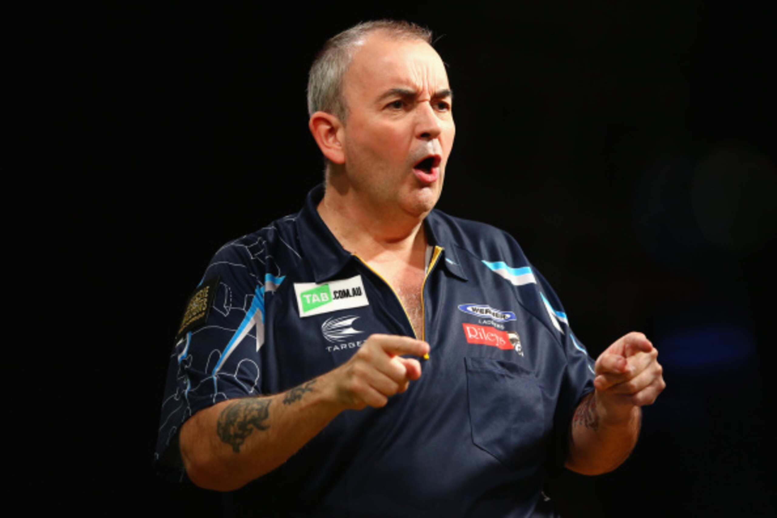 SYDNEY, AUSTRALIA - AUGUST 29:  Phil Taylor of England celebrates during his quarter-final match against Dave Chisnall of England during the Sydney Darts Masters at Hordern Pavilion on August 29, 2014 in Sydney, Australia.  (Photo by Mark Kolbe/Getty Imag