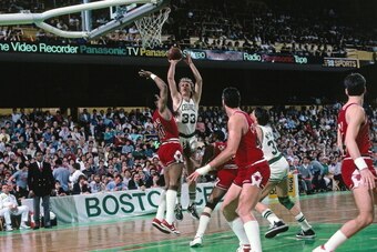 BOSTON, MA - 1986: Larry Bird #33 of the Boston Celtics takes a jump shot during a game played against the Chicago Bulls circa 1986 at the Boston Garden in Boston, Massachusetts. NOTE TO USER: User expressly acknowledges and agrees that, by downloading an