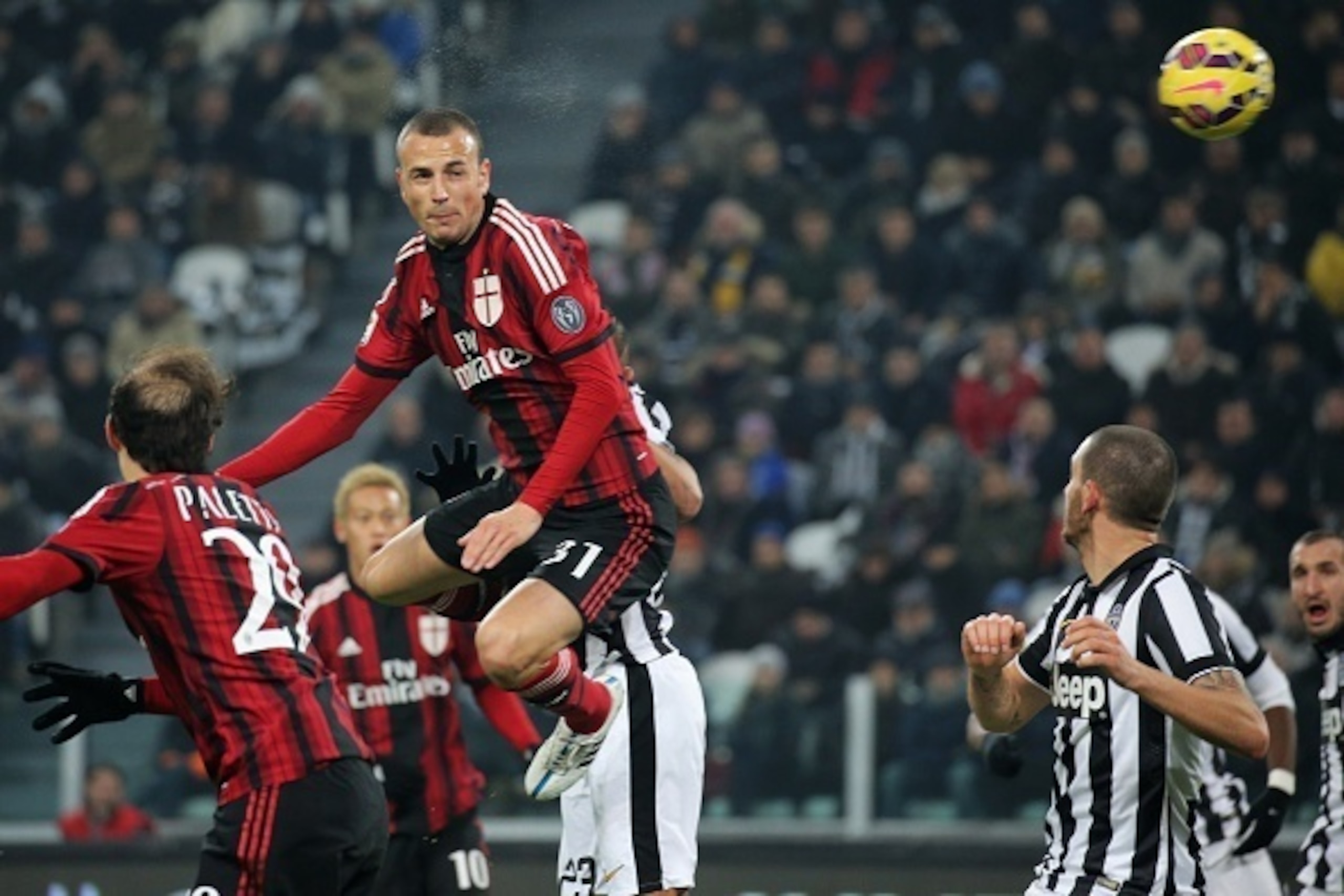AC Milan's defender Luca Antonelli (C) scores on February 7, 2015 during an Italian Serie A football match Juventus vs. AC Milan at the Juventus Stadium in Turin.  AFP PHOTO / MARCO BERTORELLO        (Photo credit should read MARCO BERTORELLO/AFP/Getty Im
