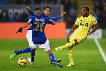 LEICESTER, ENGLAND - DECEMBER 26:  Danny Rose of Spurs passes under pressure from Riyad Mahrez and Leonardo Ulloa of Leicester City during the Barclays Premier League match between Leicester City and Tottenham Hotspur at The King Power Stadium on December