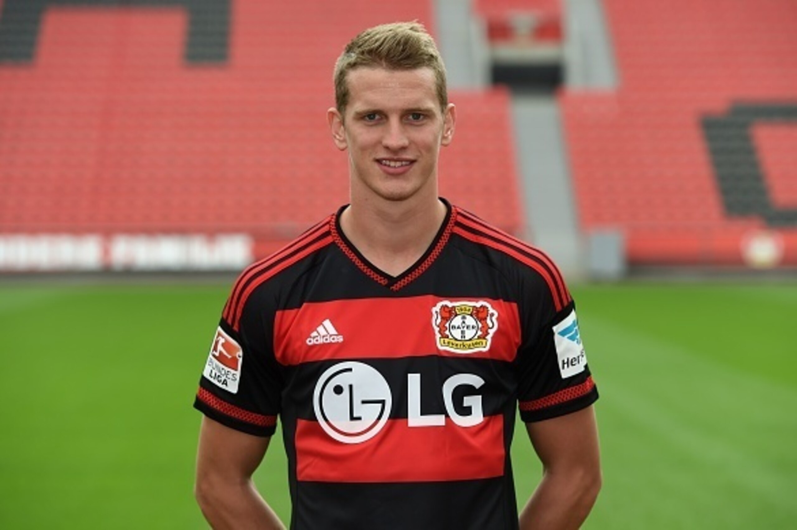 Leverkusen's midfielder Lars Bender  poses during the team presentation of the German first division Bundesliga team Bayer 04 Leverkusen at the stadium in Leverkusen, western Germany, on July 13, 2015. AFP PHOTO / PATRIK STOLLARZ        (Photo credit shou