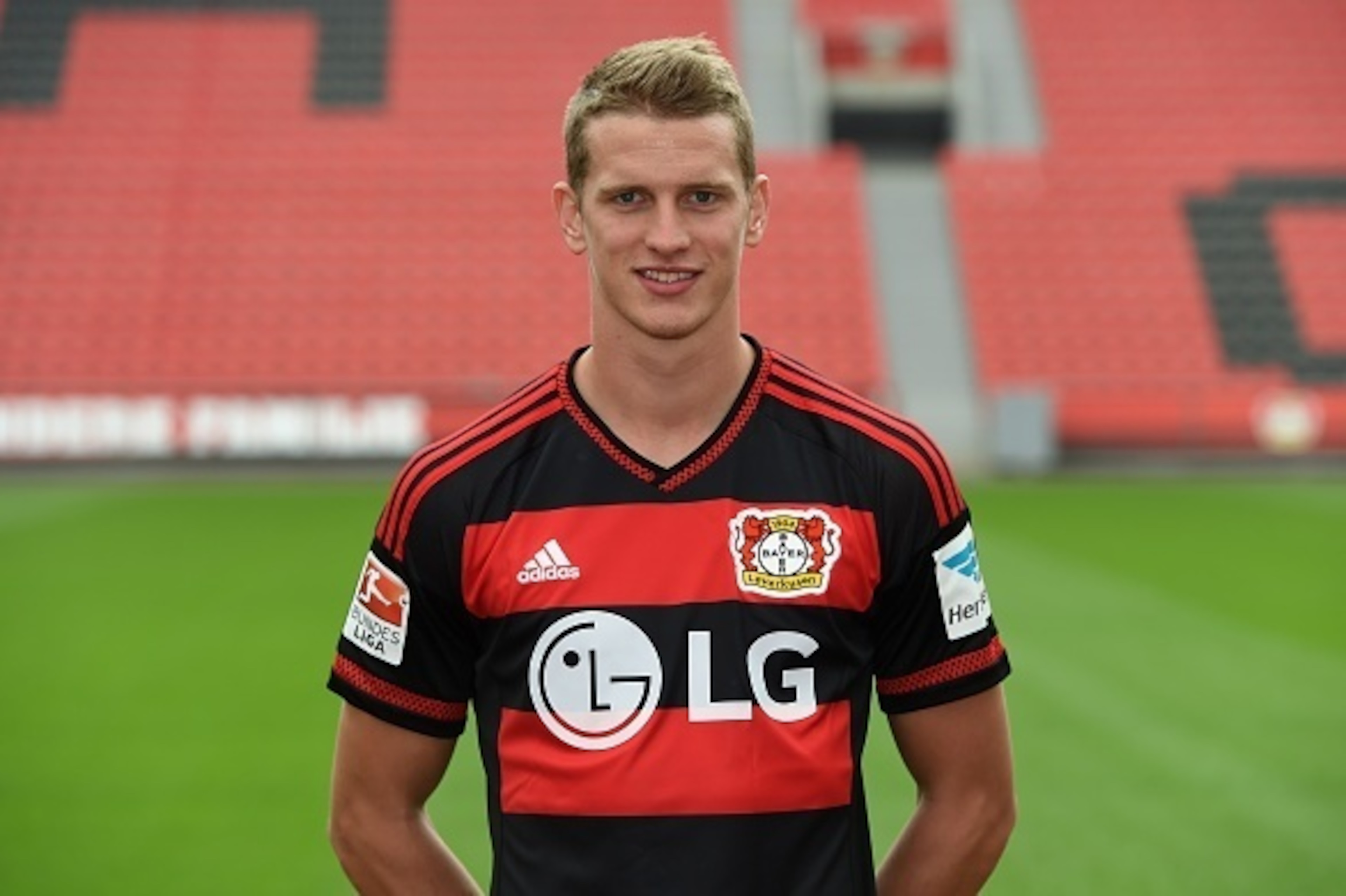 Leverkusen's midfielder Lars Bender  poses during the team presentation of the German first division Bundesliga team Bayer 04 Leverkusen at the stadium in Leverkusen, western Germany, on July 13, 2015. AFP PHOTO / PATRIK STOLLARZ        (Photo credit shou