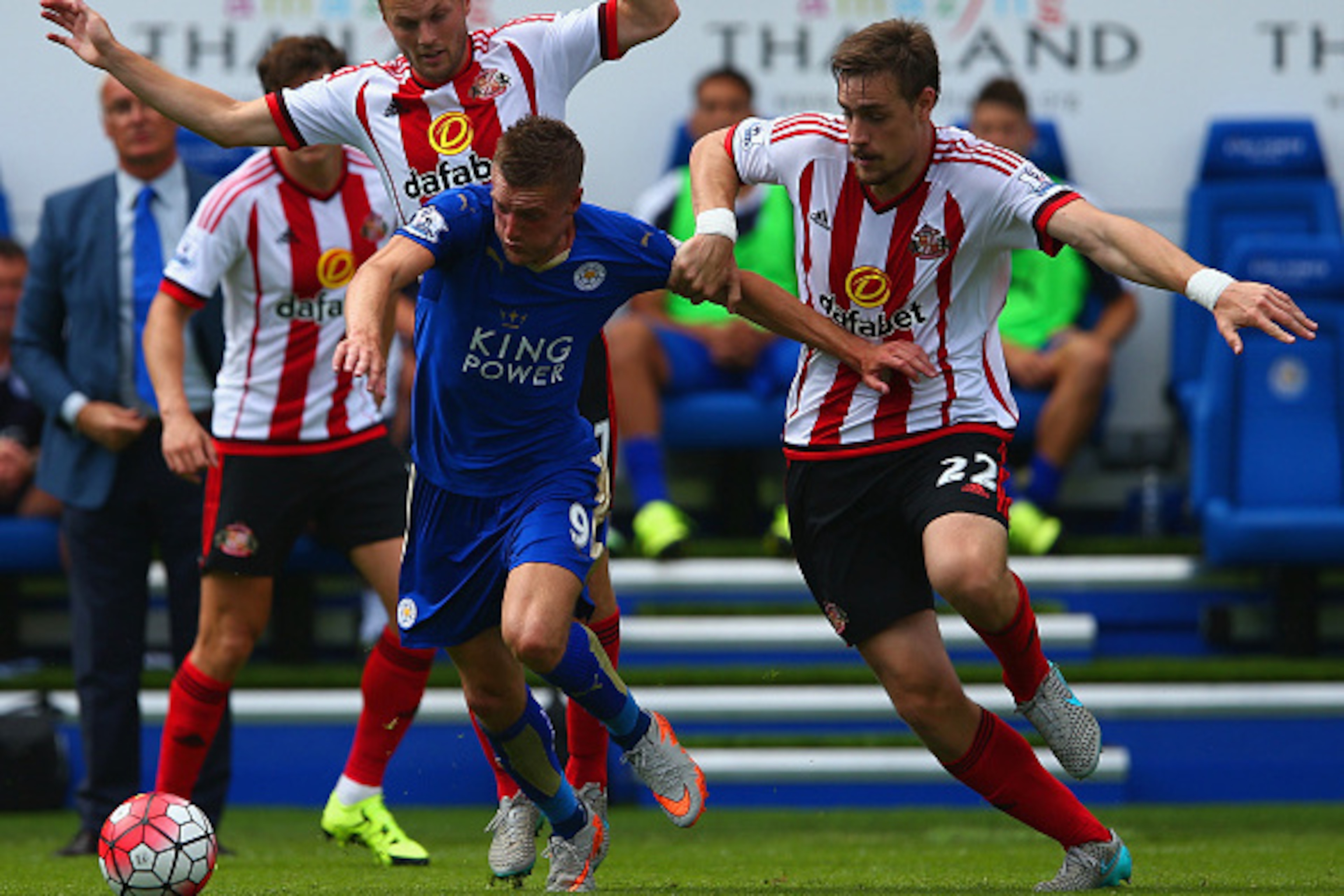 LEICESTER, ENGLAND - AUGUST 08: Jamie Vardy of Leicester City and Sebastian Coates of Sunderland compete for the ball  during the Barclays Premier League match between Leicester City and Sunderland at The King Power Stadium on August 8, 2015 in Leicester,