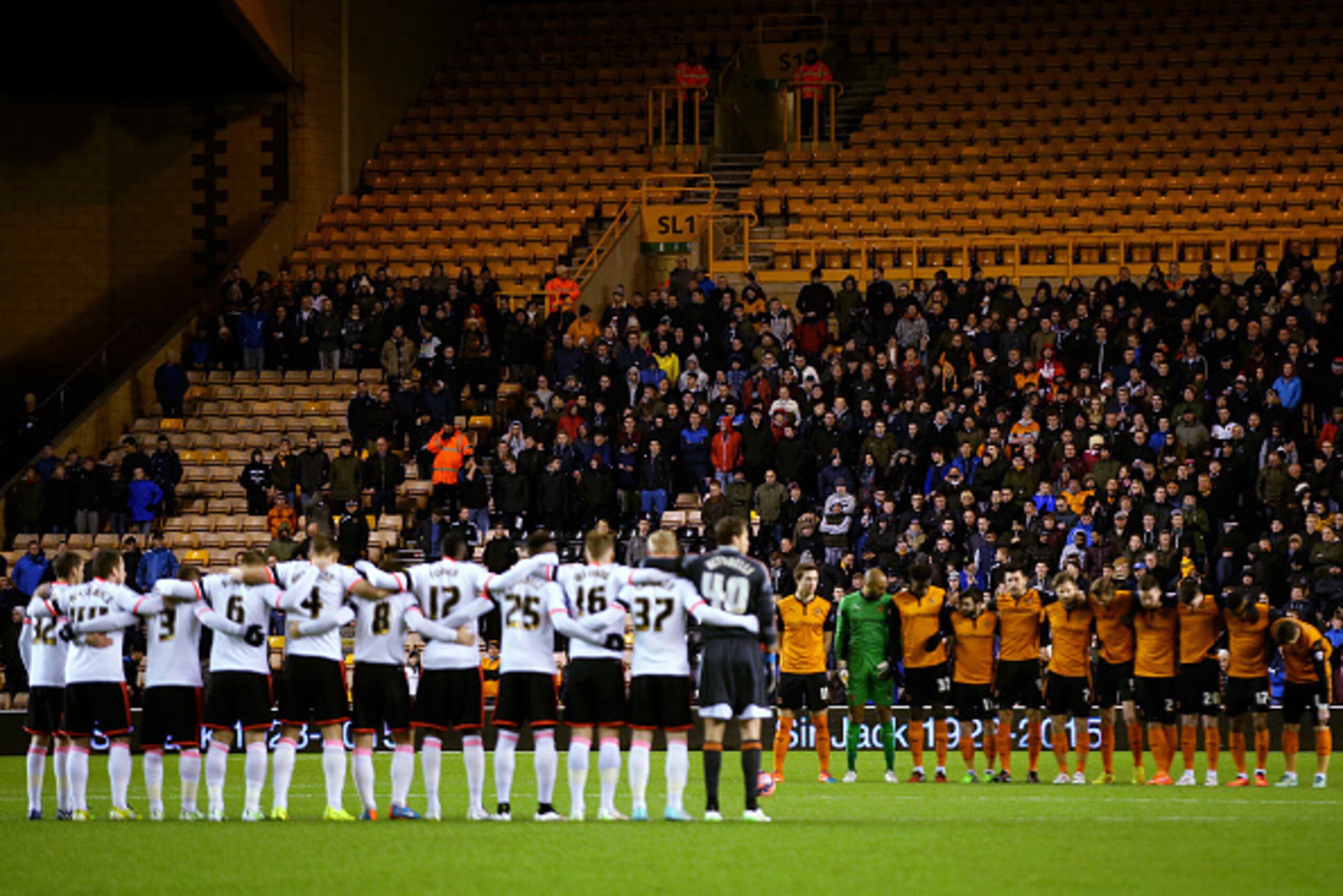WOLVERHAMPTON, ENGLAND - JANUARY 13:  Fans and players observe a minute's silence for former Wolves owner Sir Jack Hayward before the FA Cup third round replay match between Wolverhampton Wanderers and Fulham at Molineux on January 13, 2015 in Wolverhampt