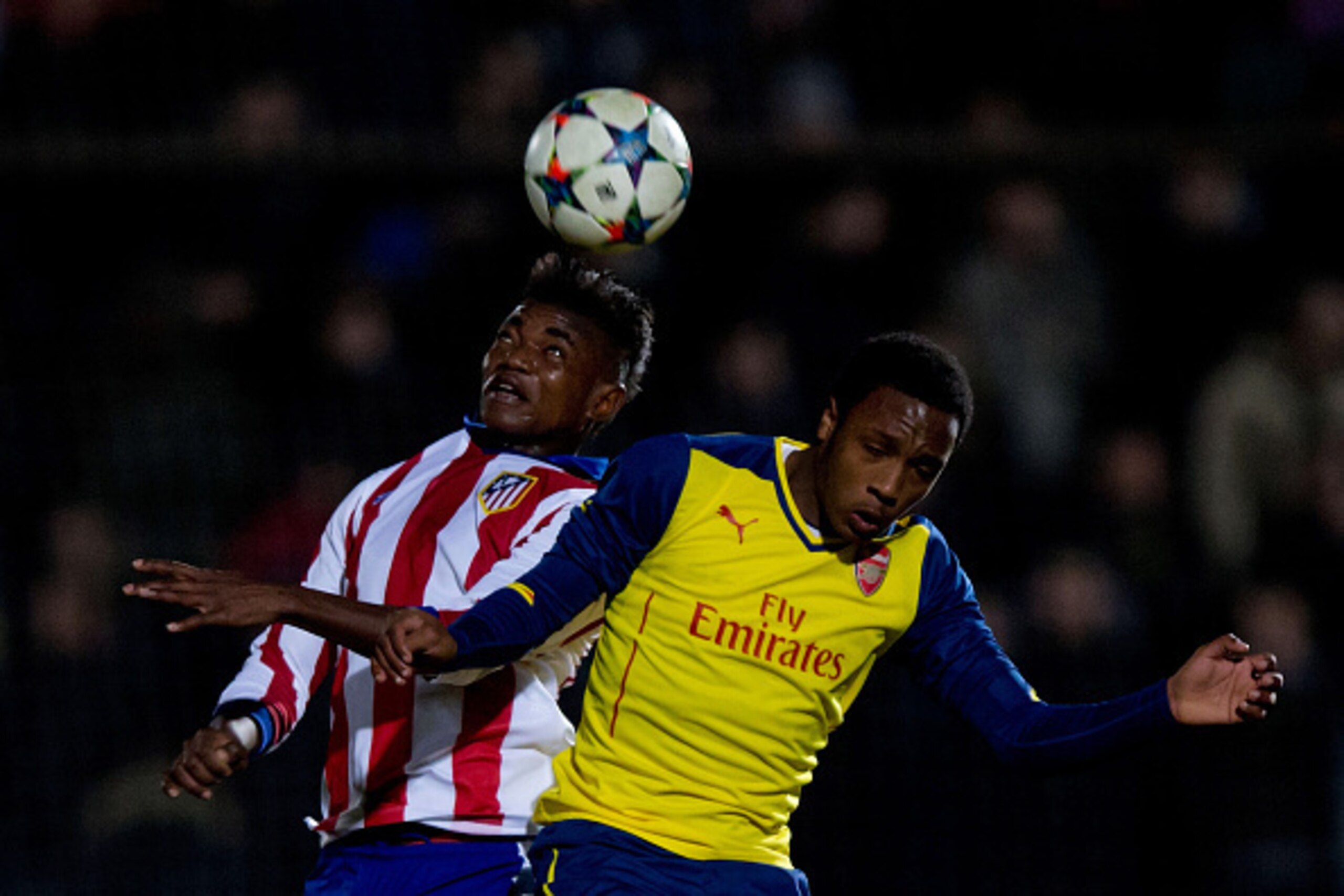 MAJADAHONDA, SPAIN - JANUARY 27:  Nombo Otia of Atletico de Madrid wins the header before Hinds Kaylen of Arsenal during the UEFA Youth League match between Atletico de Madrid and Arsenal at Atletico de Madrid Sport City on January 27, 2015 in Majadahonda