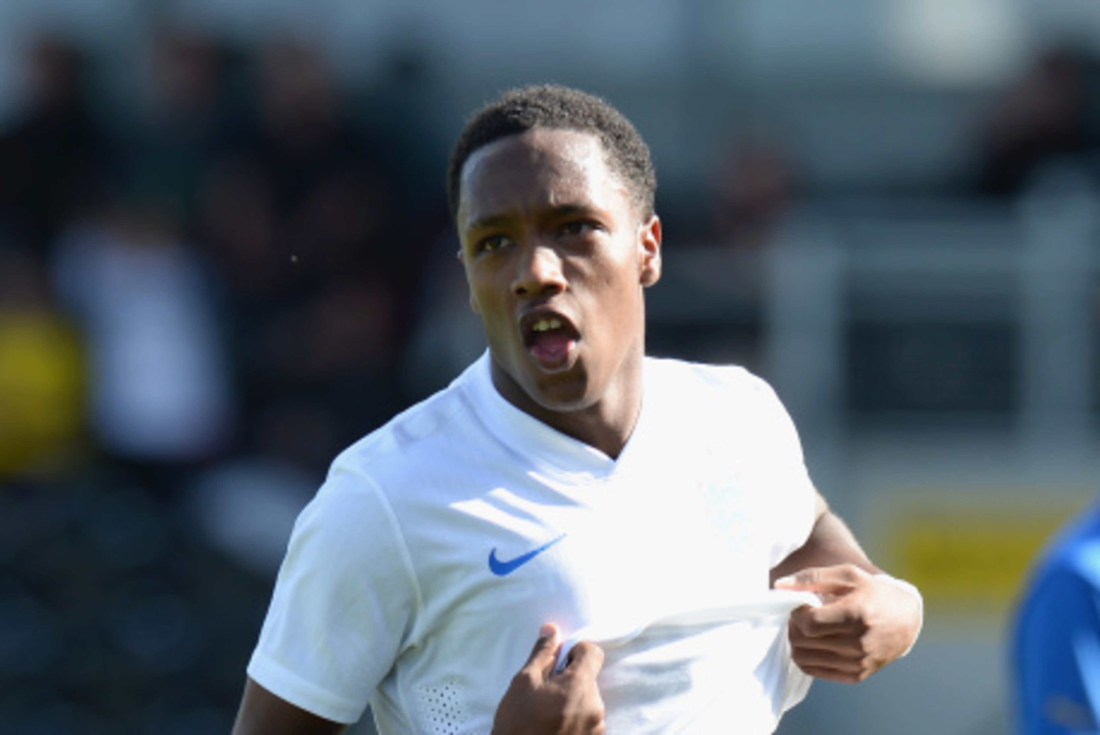 BURTON-UPON-TRENT, ENGLAND - AUGUST 31:  Kaylen Hinds of England celebrates scoring their fourth goal during the International match betweeen Engand Under 17 and Italy Under17 at Pirelli Stadium on August 31, 2014 in Burton-upon-Trent, England.  (Photo by