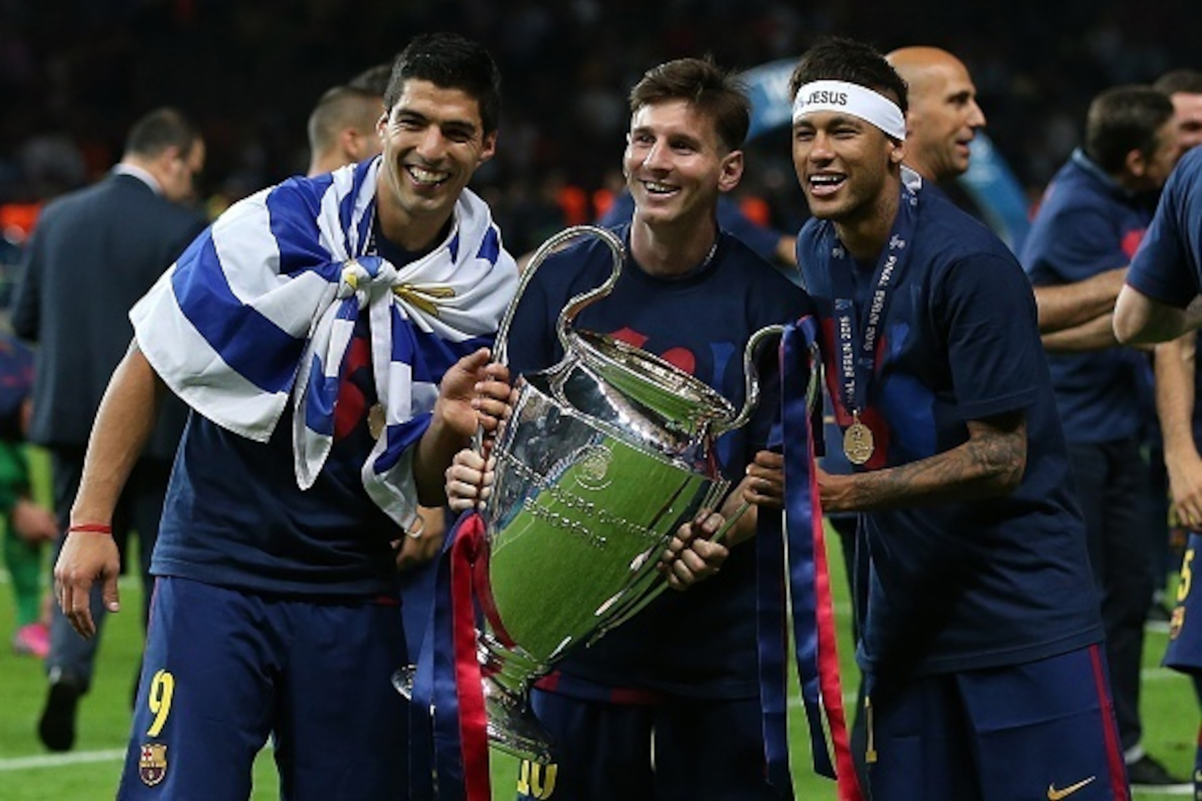BERLIN, GERMANY - JUNE 6: (l-r) Luis Suarez, Lionel Messi and Neymar of FC Barcelona celebrate with the trophy following the UEFA Champions League Final match between Juventus and FC Barcelona at the Olympiastadion on June 6, 2015 in Berlin, Germany. (Pho