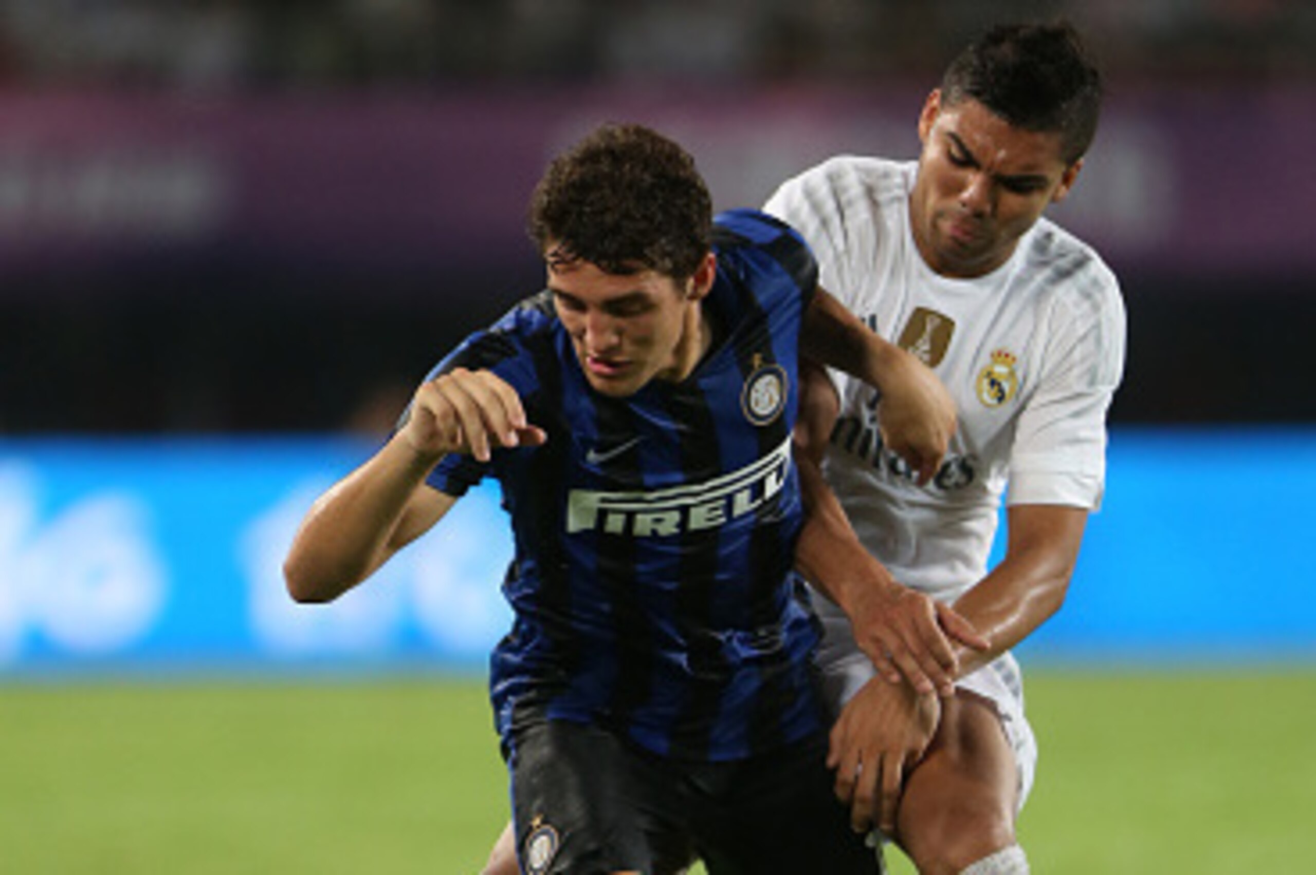 GUANGZHOU, CHINA - JULY 27: Casemiro of Real Madrid competes with Kovacic Mateo of FC Internazionale during the match of International Champions Cup China 2015 between Real Madrid and FC Internazionale at Tianhe Stadium on July 27, 2015 in Guangzhou, Chin