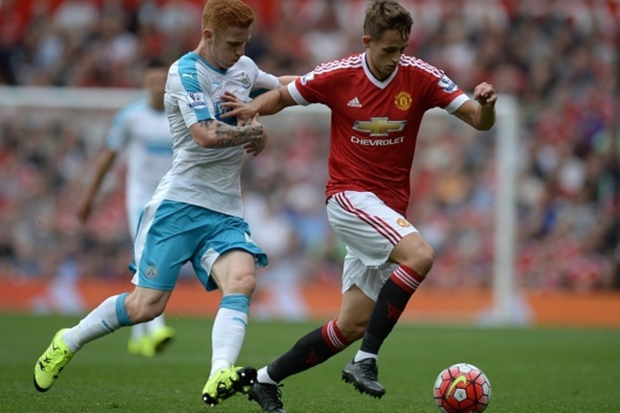 Manchester United's Belgian midfielder Adnan Januzaj (R) vies with Newcastle United's English midfielder Jack Colback during the English Premier League football match between Manchester United and Newcastle United at Old Trafford in Manchester, north west