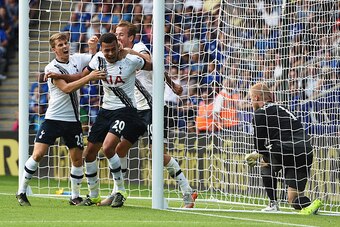 LEICESTER, ENGLAND - AUGUST 22: Dele Alli (2nd L) of Tottenham Hotspur celebrates scoring his team's first goal with his team mates Tom Carroll (1st  L) and Harry Kane (3rd L) during the Barclays Premier League match between Leicester City and Tottenham H
